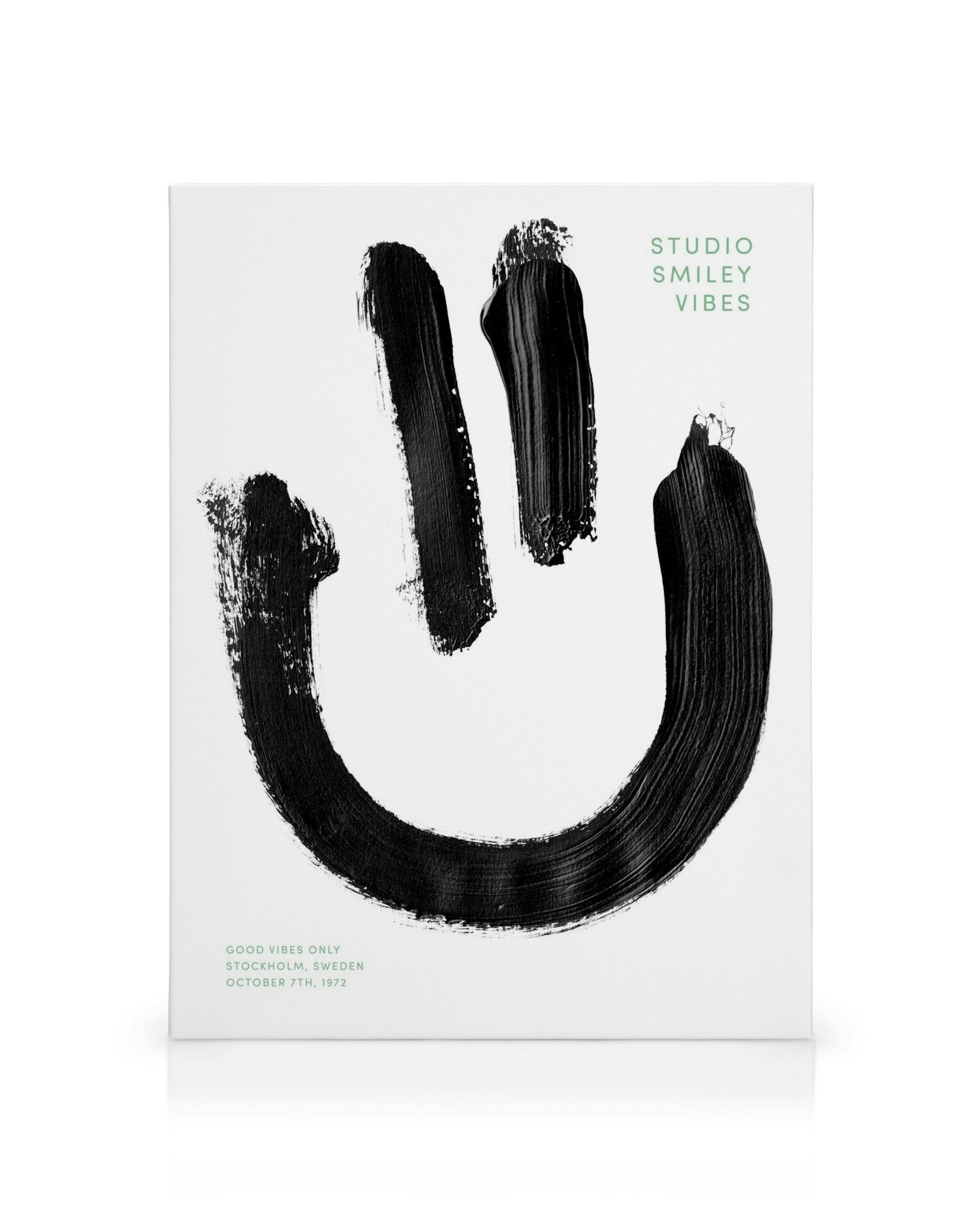 Smiley Vibe canvas met zwart, getextureerd smileygezicht en tekst op witte achtergrond.