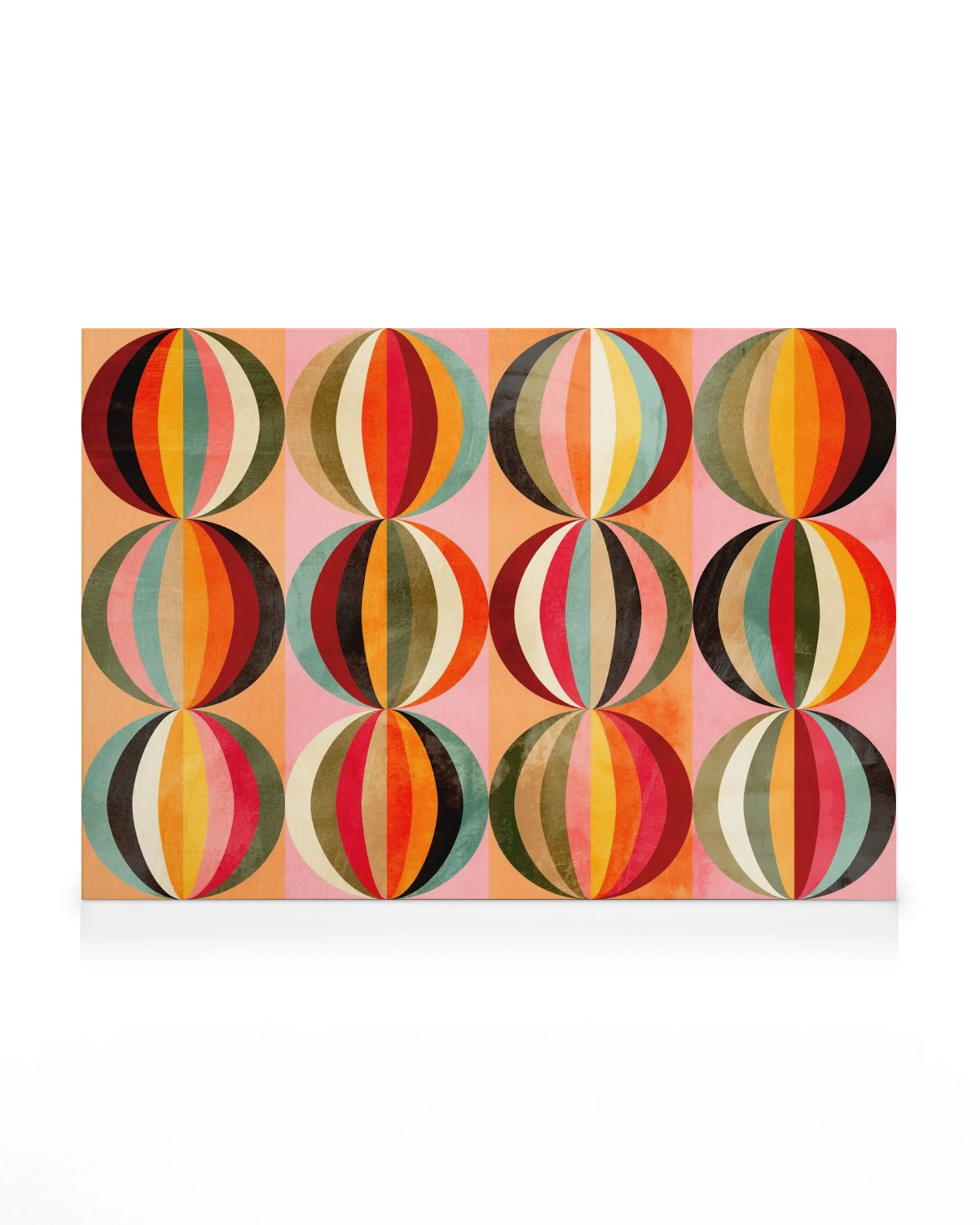 A canvas print featuring colourful mid-century modern abstract circles on a striped pink and beige background.