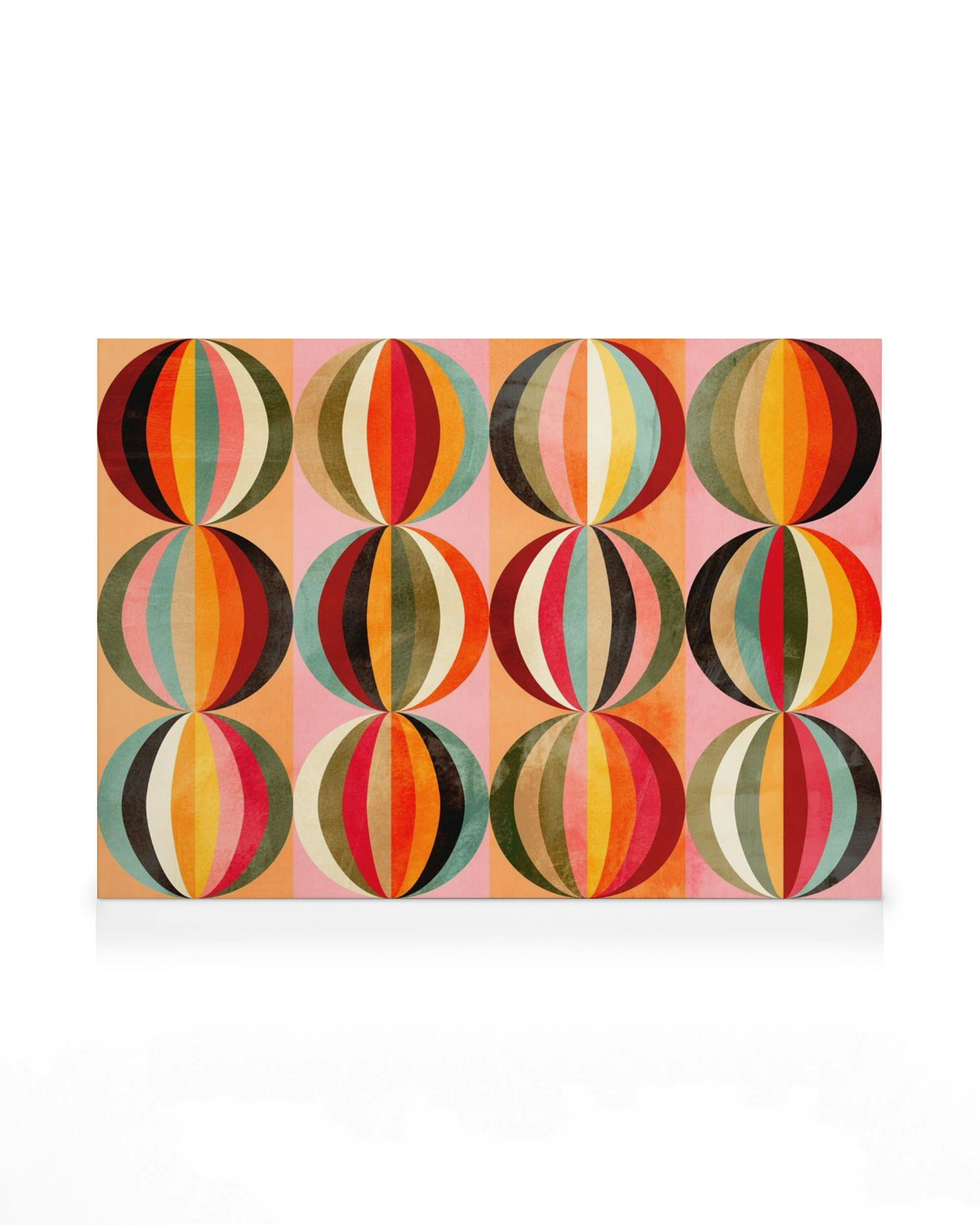 A canvas print featuring a retro pattern of colourful striped spheres on a background of salmon and pink vertical stripes.