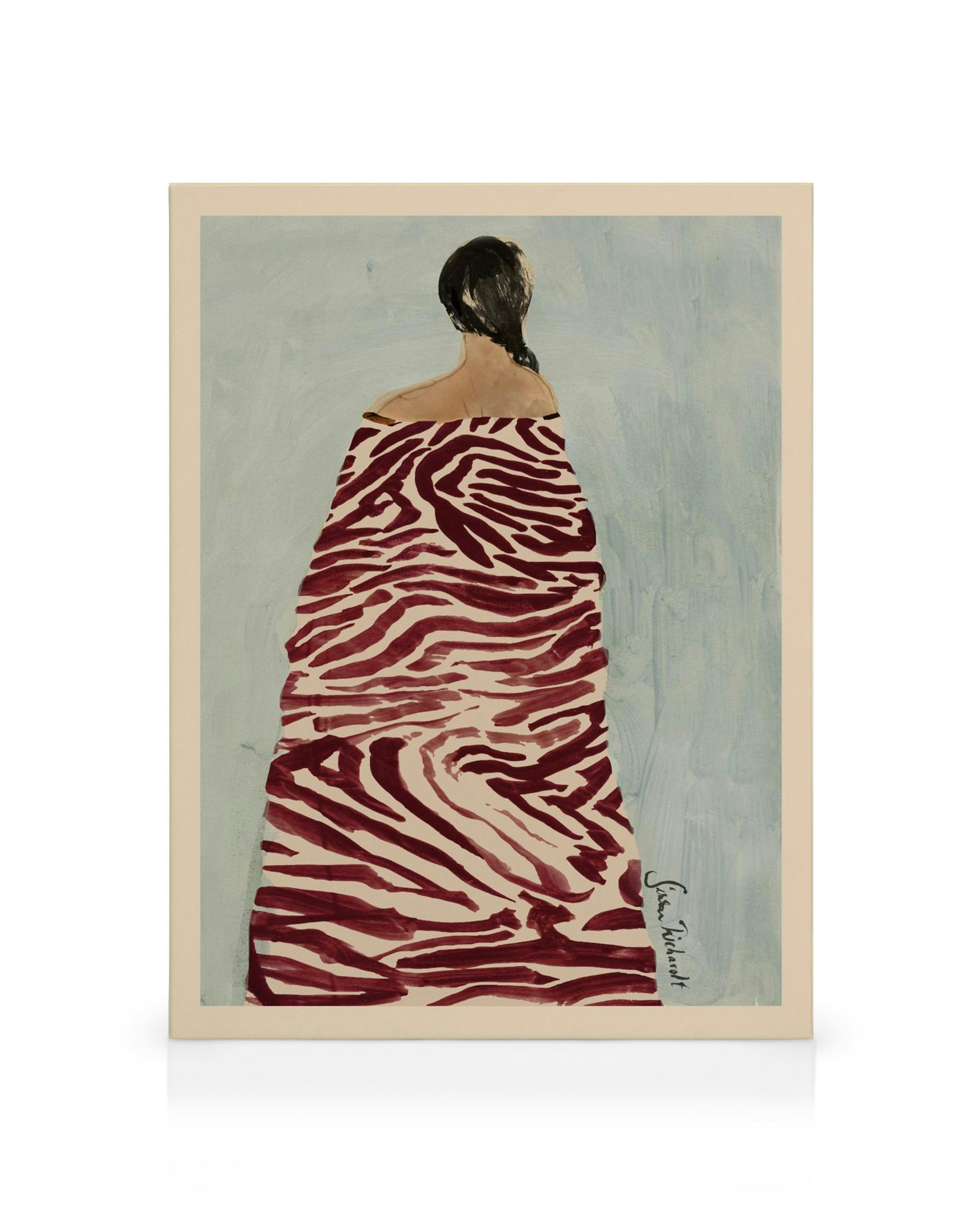 A canvas print featuring a woman from behind, wearing a flowing dress with a maroon zebra print pattern against a light blue bac