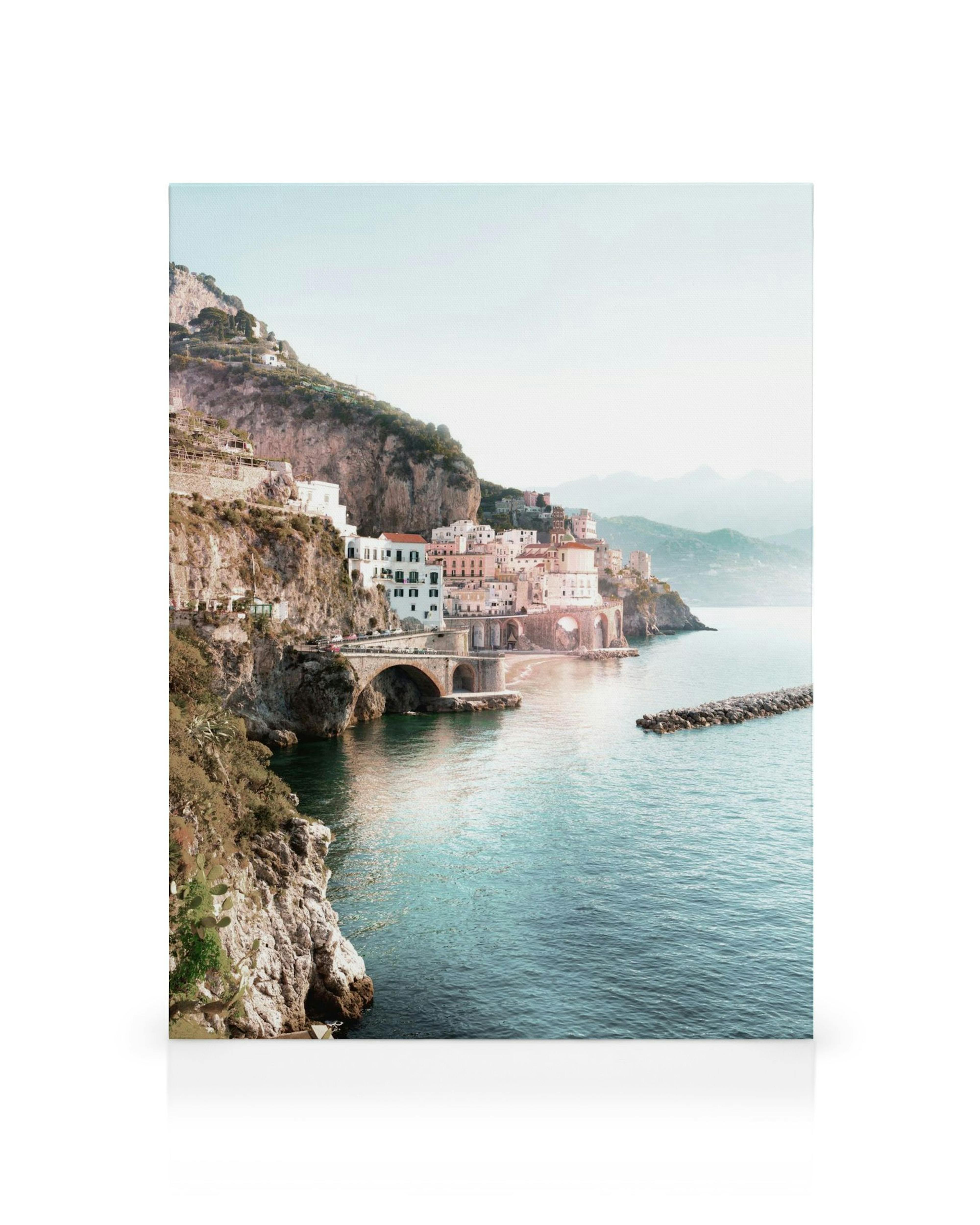 Amalfi Coast canvas print, showcasing a beautiful Italian coastal town with white buildings and a bridge over turquoise water.