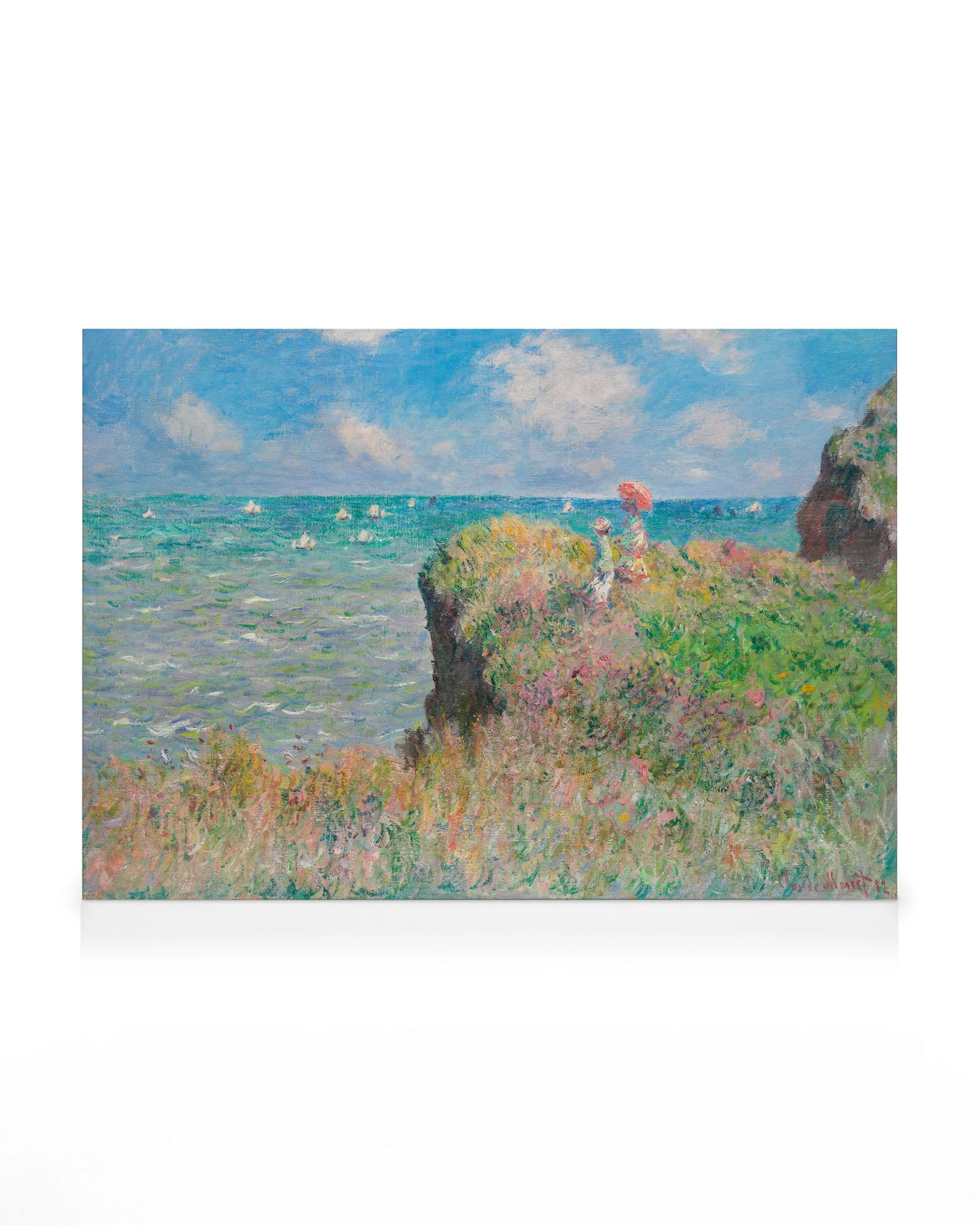 Oljeväggmålning av Monet föreställande två kvinnor på en klippa med grön vegetation och blått hav i bakgrunden.