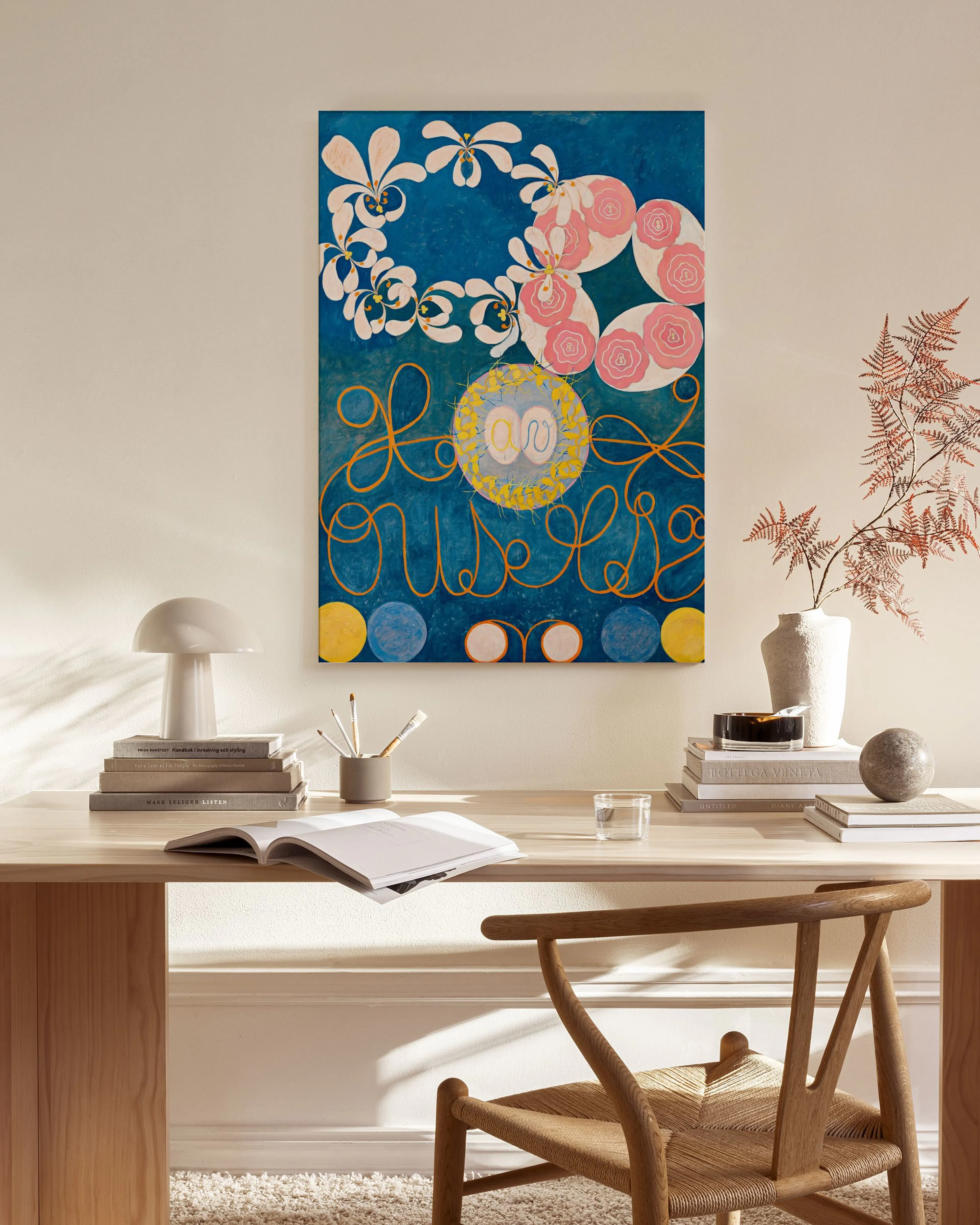 A vibrant canvas print with a deep blue background featuring white flowers, pink rose-like shapes, and yellow swirling lines.