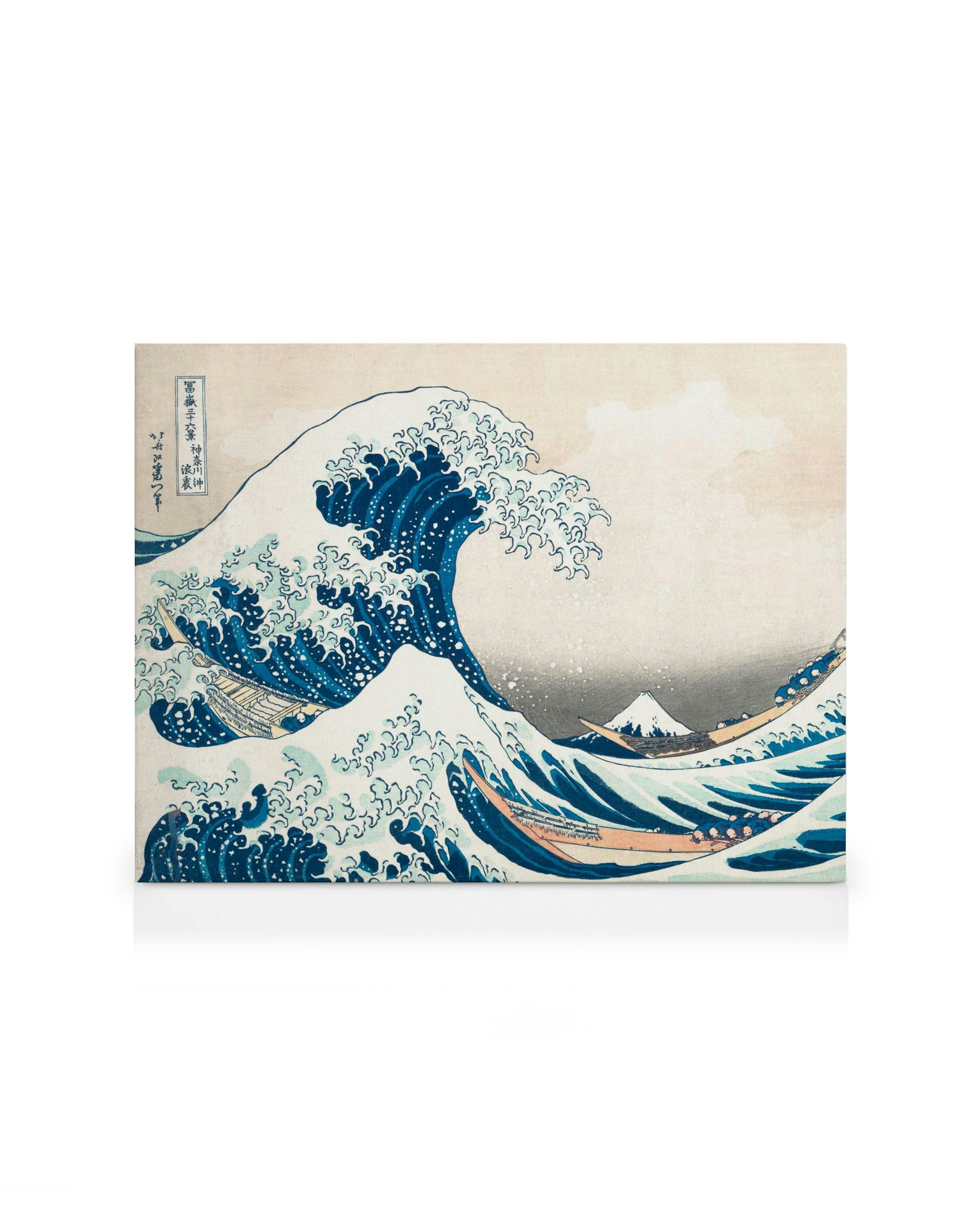 Hokusais The Great Wave canvas print, featuring a large blue wave, boats, and Mount Fuji against a beige sky.