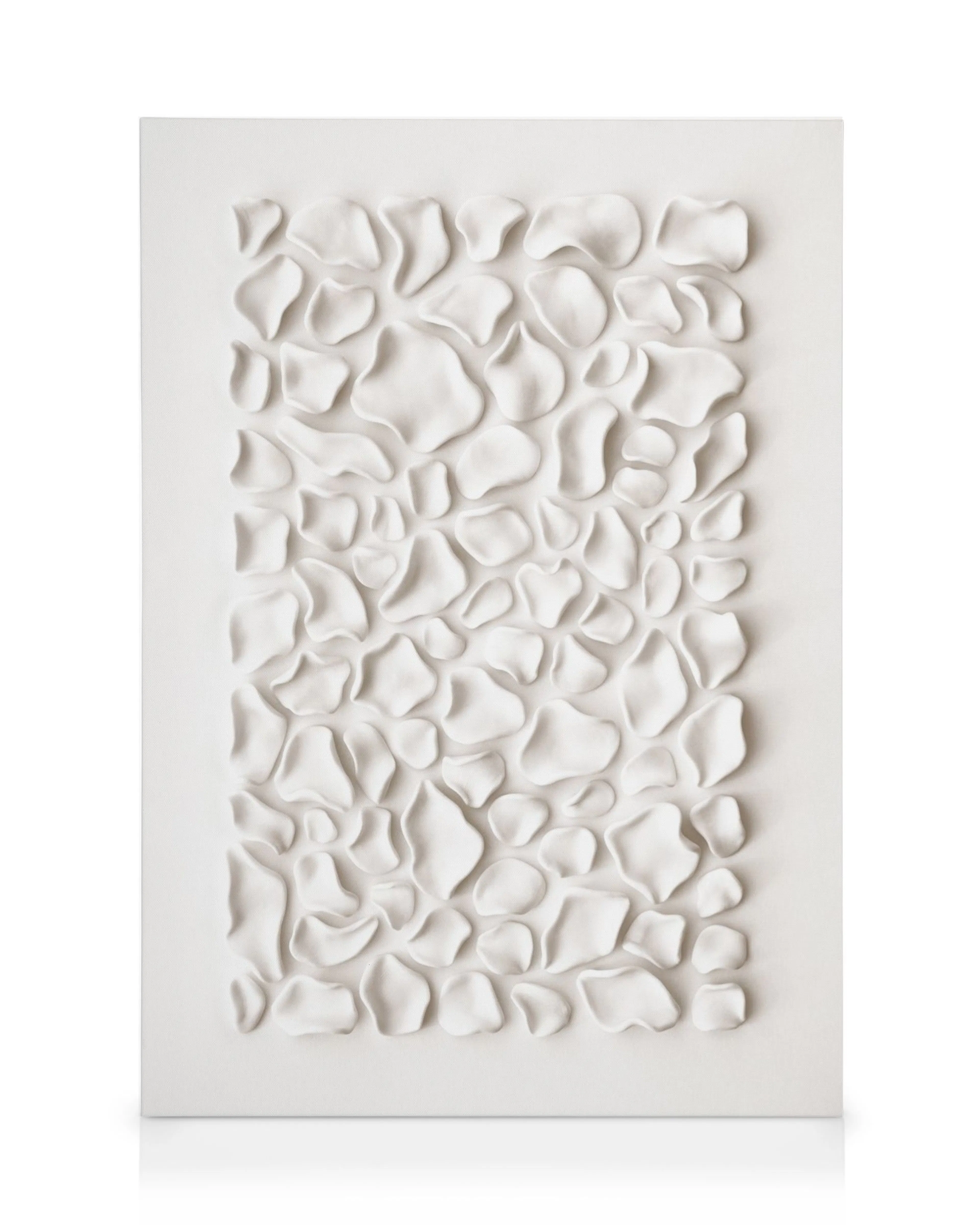 Soft aligned white shapes creating a cushioned surface with depth and shadows, a unique canvas print.