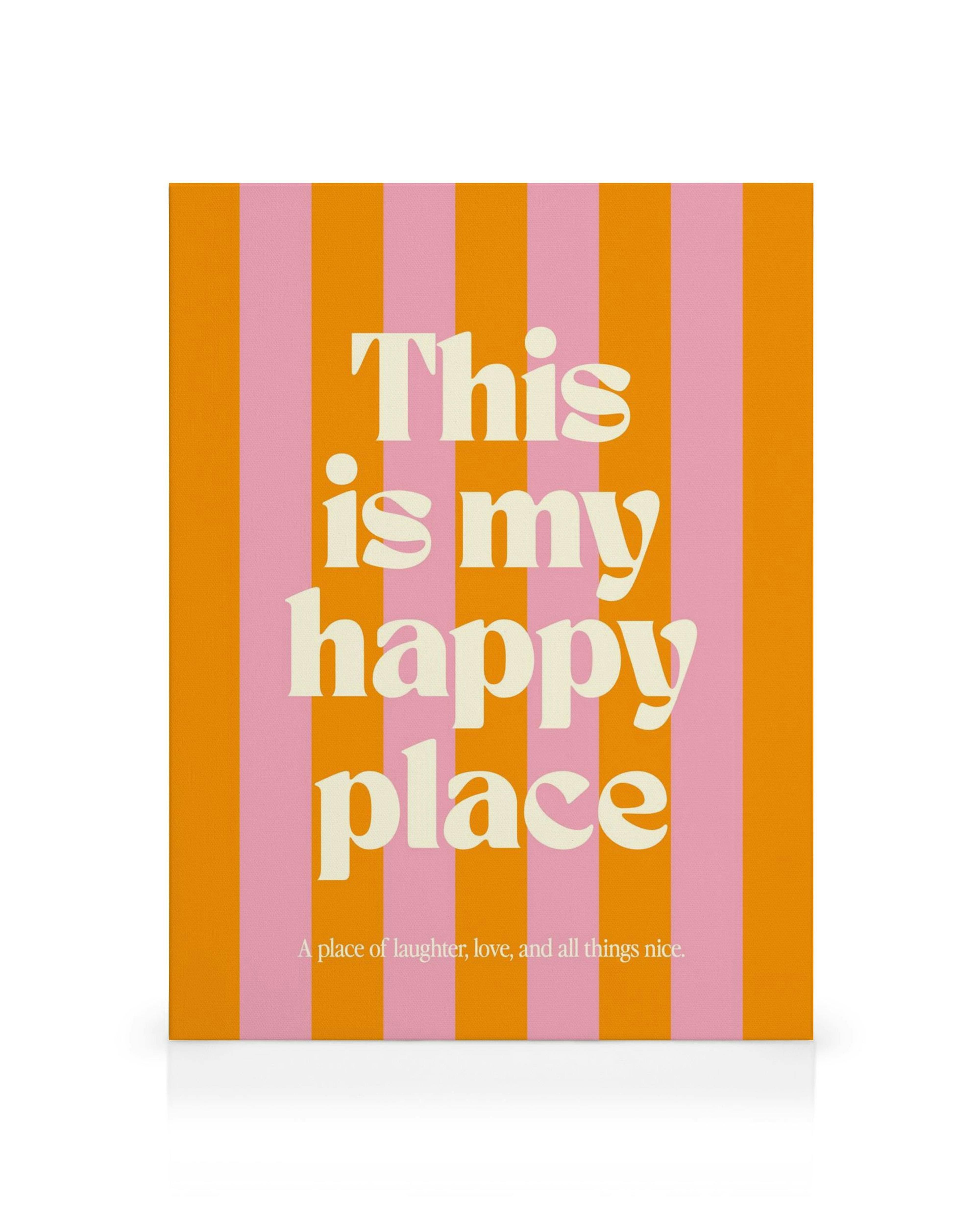 Tela decorativa com fundo de riscas laranja e rosa, e a frase This is my happy place em letras creme.