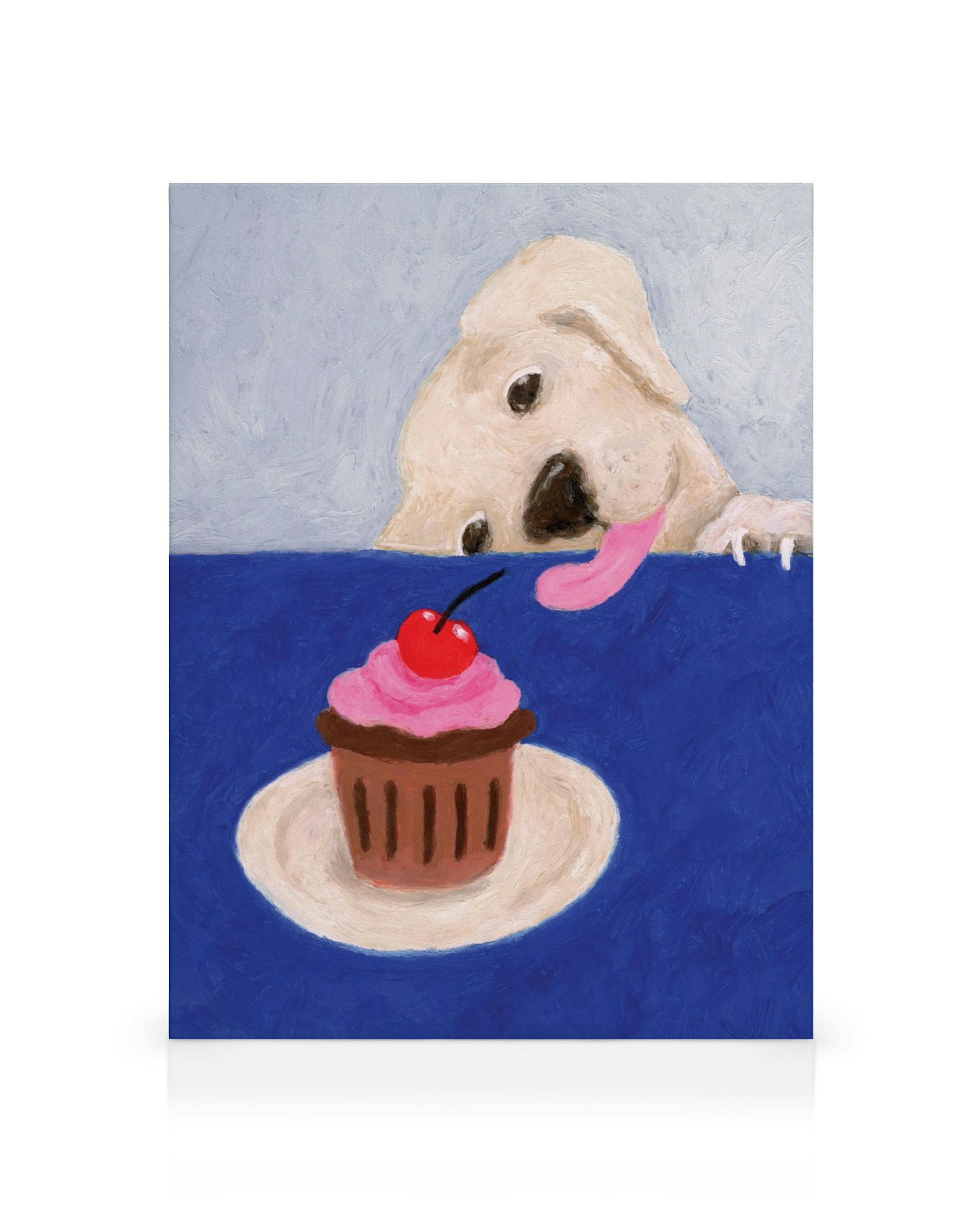 Obraz na płótnie przedstawiający uroczego psa z wyciągniętym językiem, próbującego dosięgnąć babeczki z wisienką.