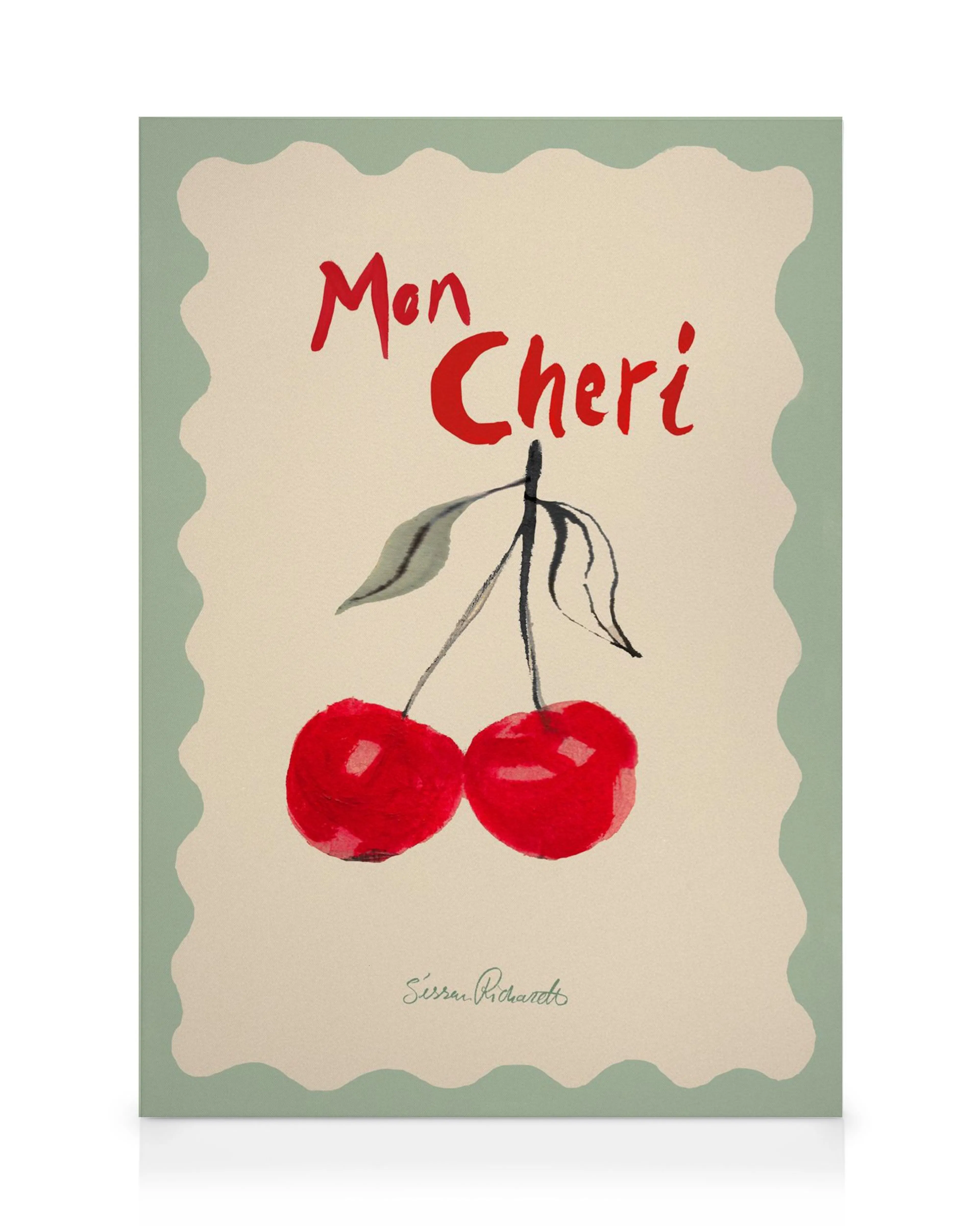 A canvas print featuring two red cherries on a stem with leaves, and Mon Cheri in red script on a cream background.