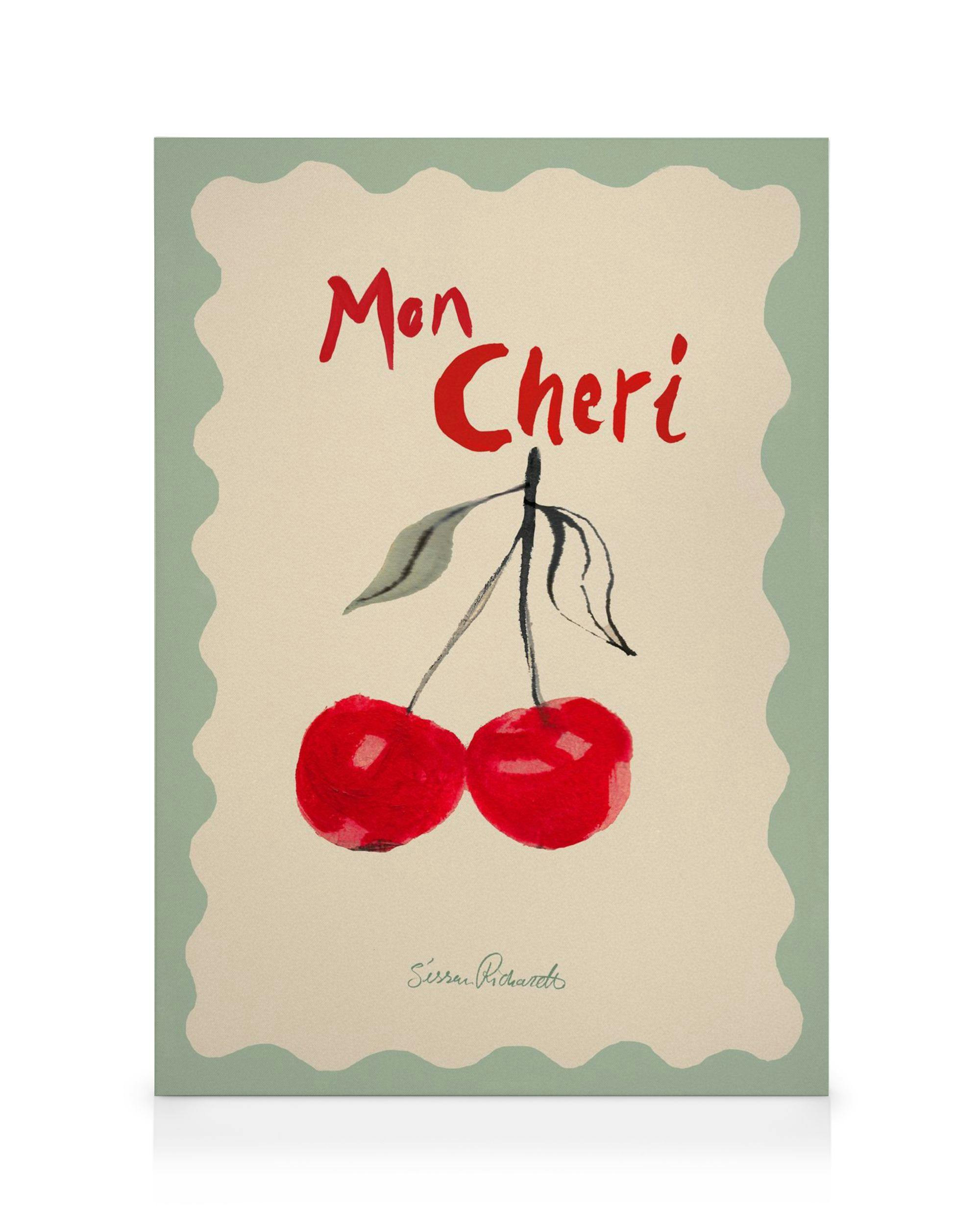 Stampa su tela con due ciliegie rosse e scritta Mon Cheri su sfondo beige con bordo verde ondulato.