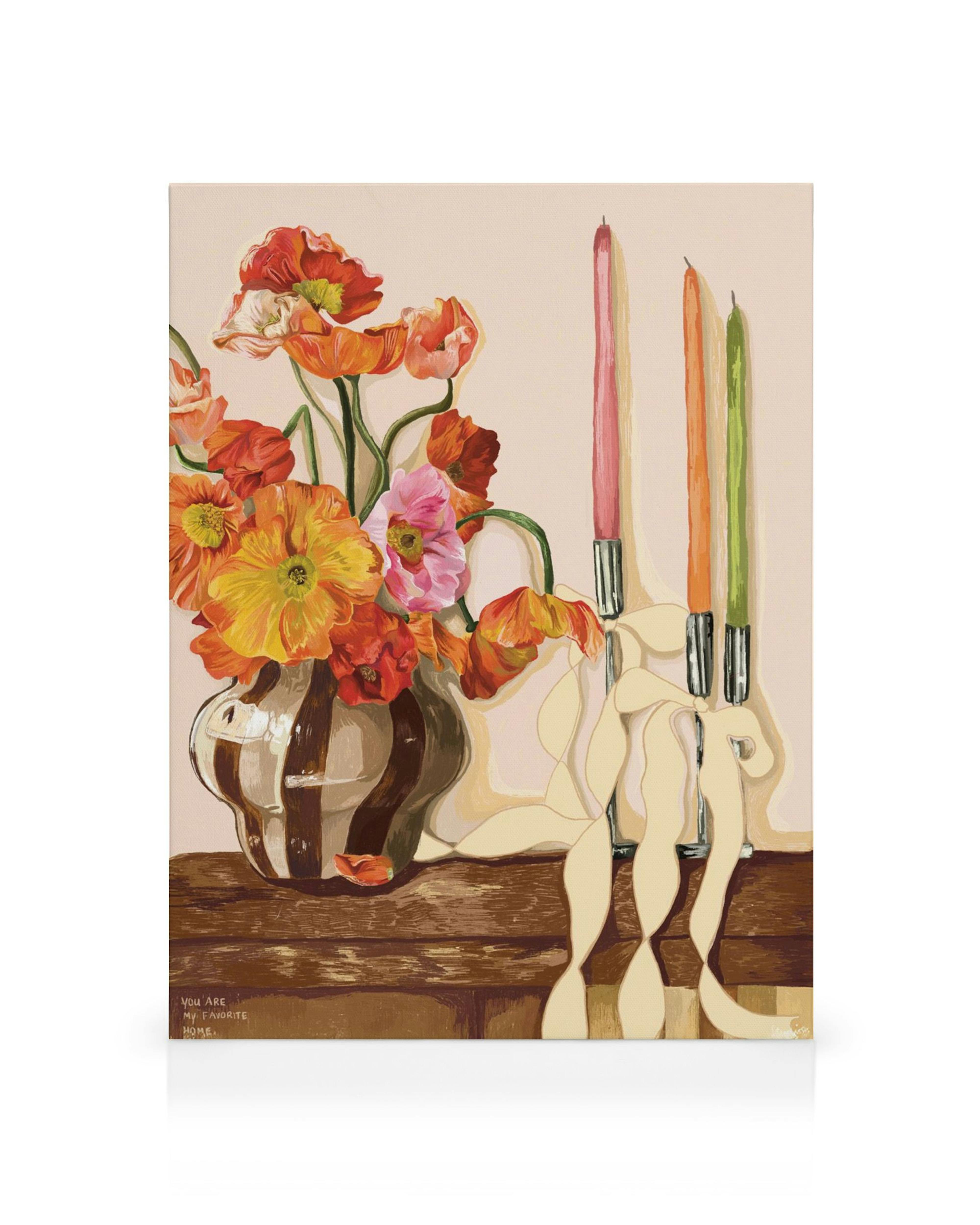 A canvas print featuring a vibrant floral arrangement in a striped vase next to three colourful candles on a wooden surface.