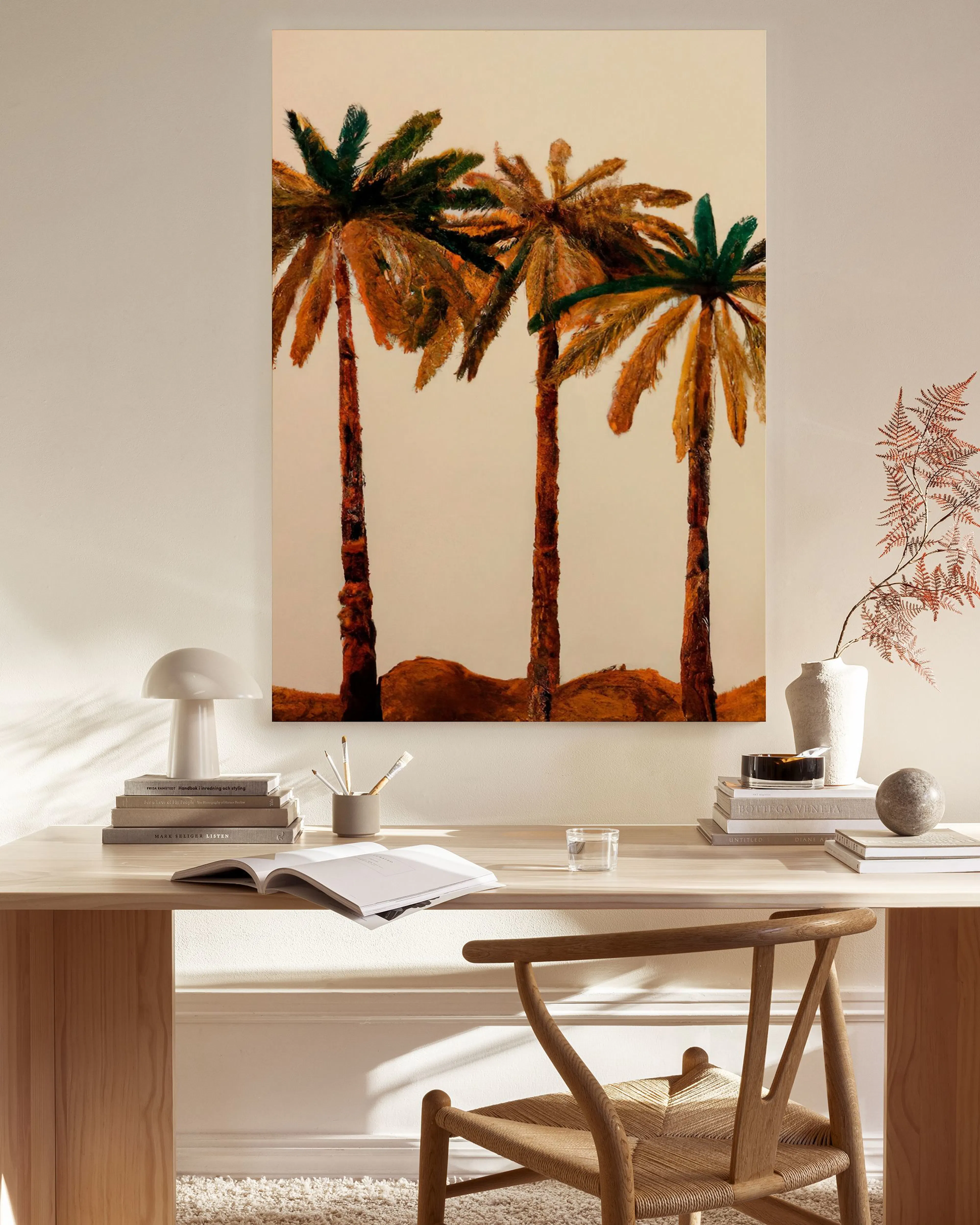 A canvas print of three vibrant palm trees on a desert landscape, hanging in a bright, minimalist living room.