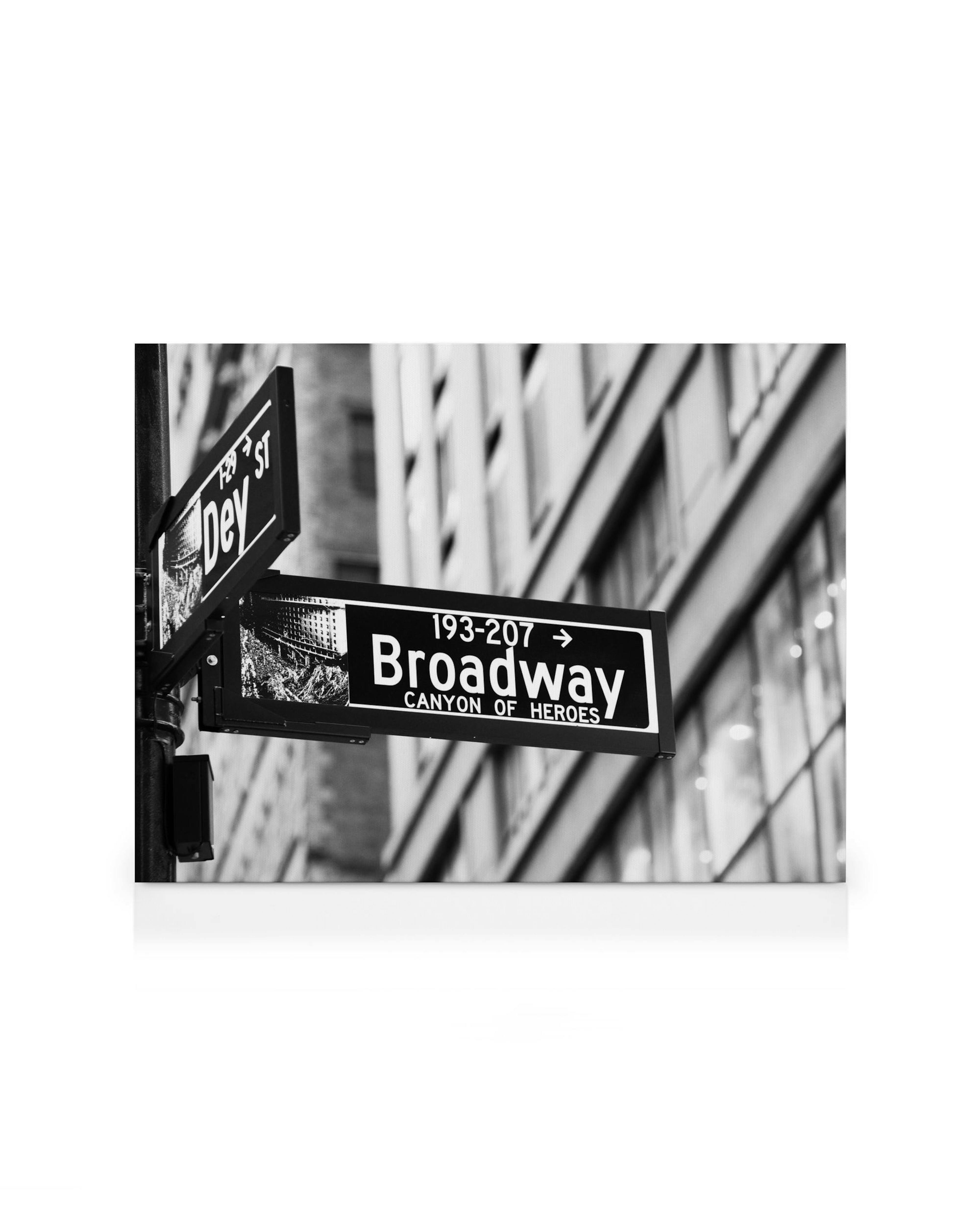 Black and white Broadway street sign in New York. Urban cityscape wall art with iconic Canyon Of Heroes detail.