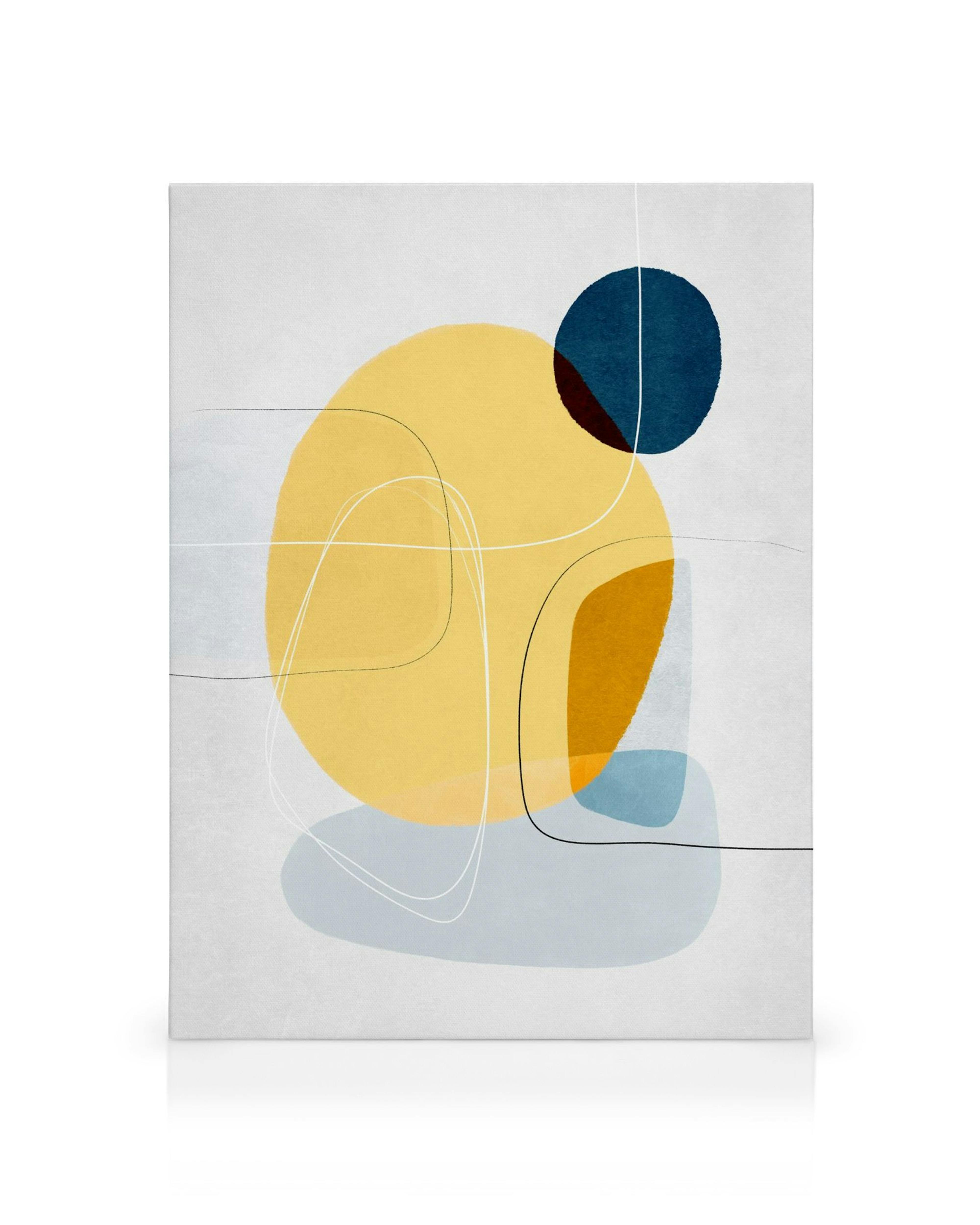 Contemporary abstract canvas print with yellow, blue, orange, and grey overlapping shapes on a textured white background.