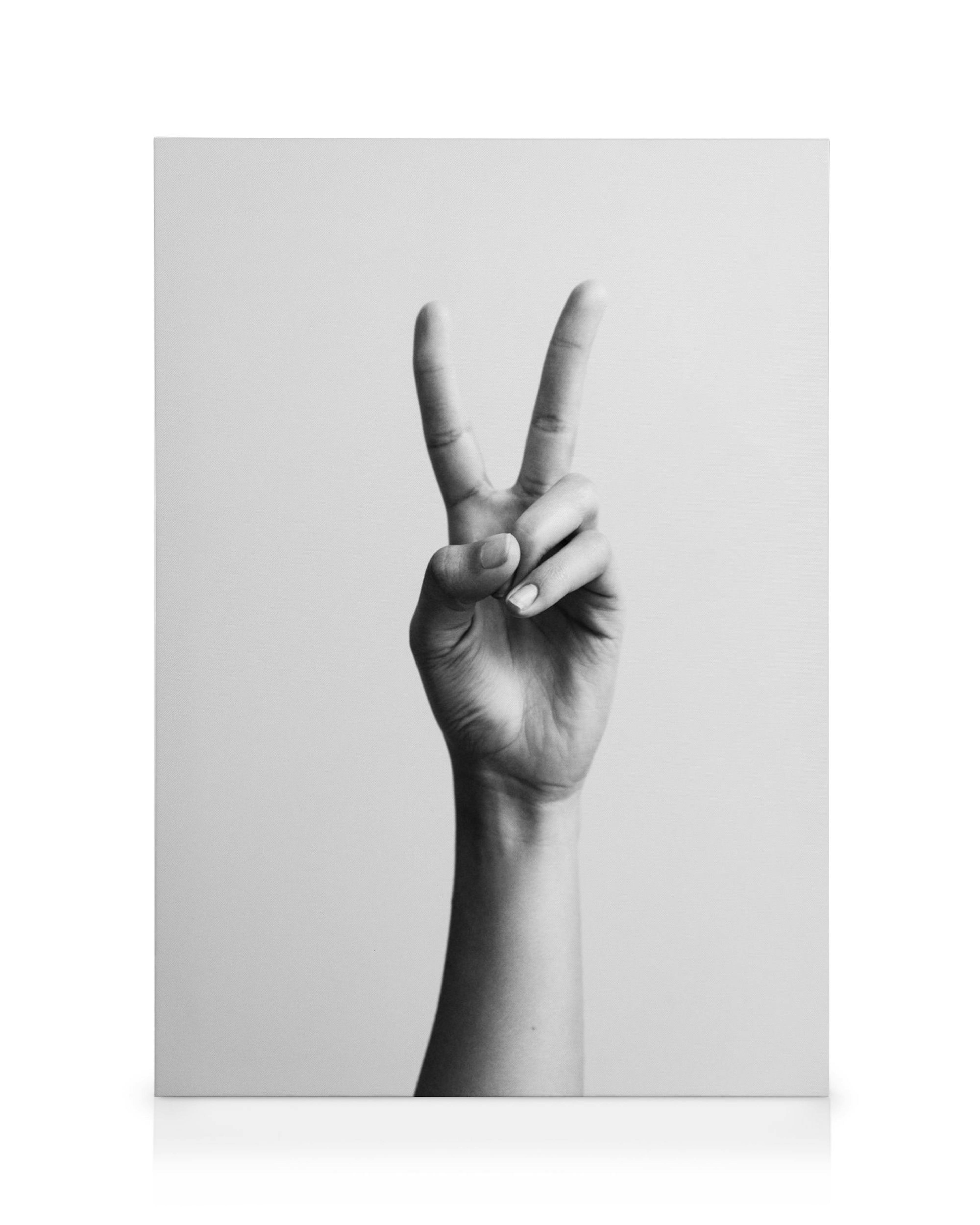 Stampa su tela con mano che mostra il segno di pace, sfondo chiaro, bianco e nero, simbolo di pace.