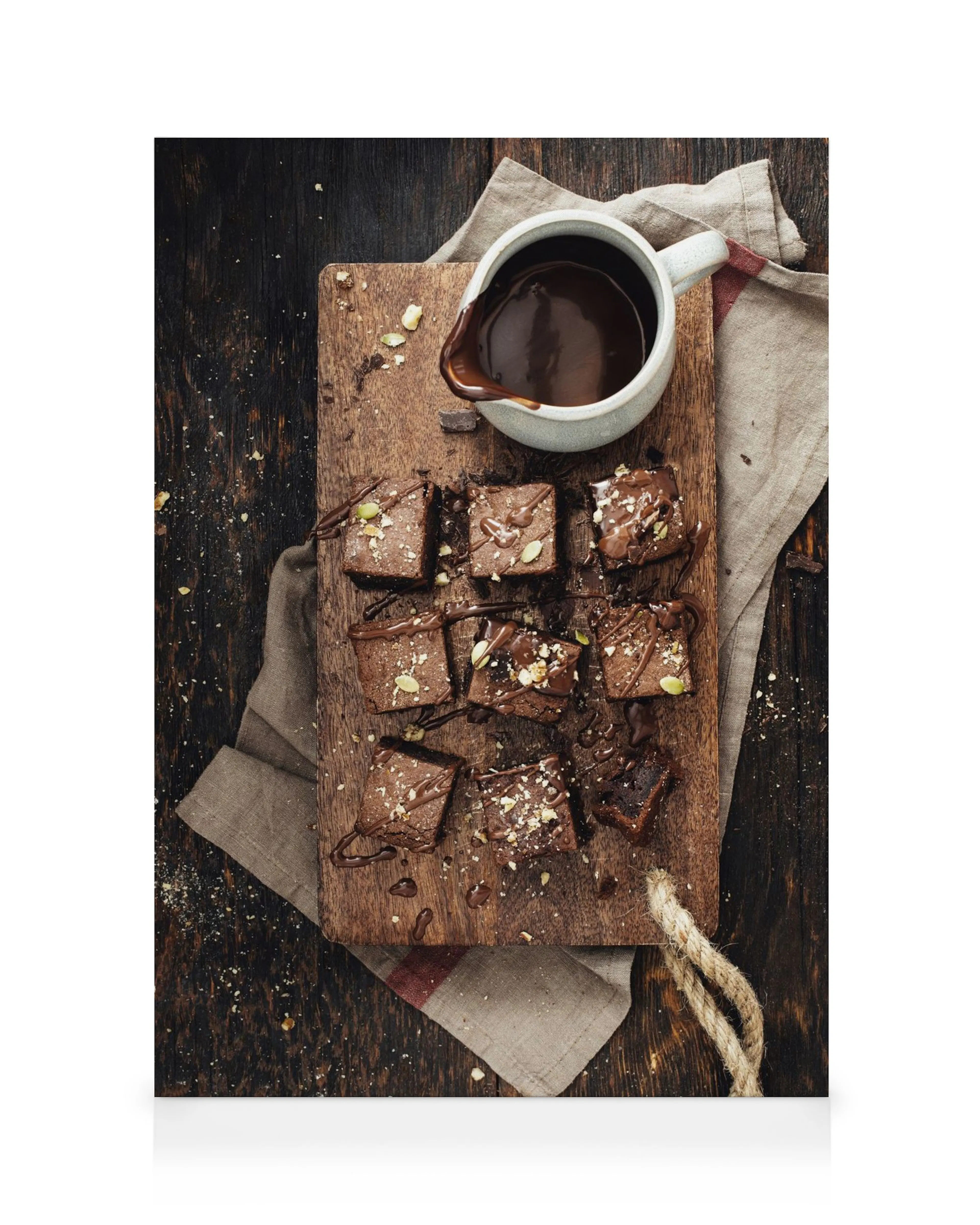 Chocolate brownies on a wooden board with chocolate sauce, perfect kitchen or food themed wall art.