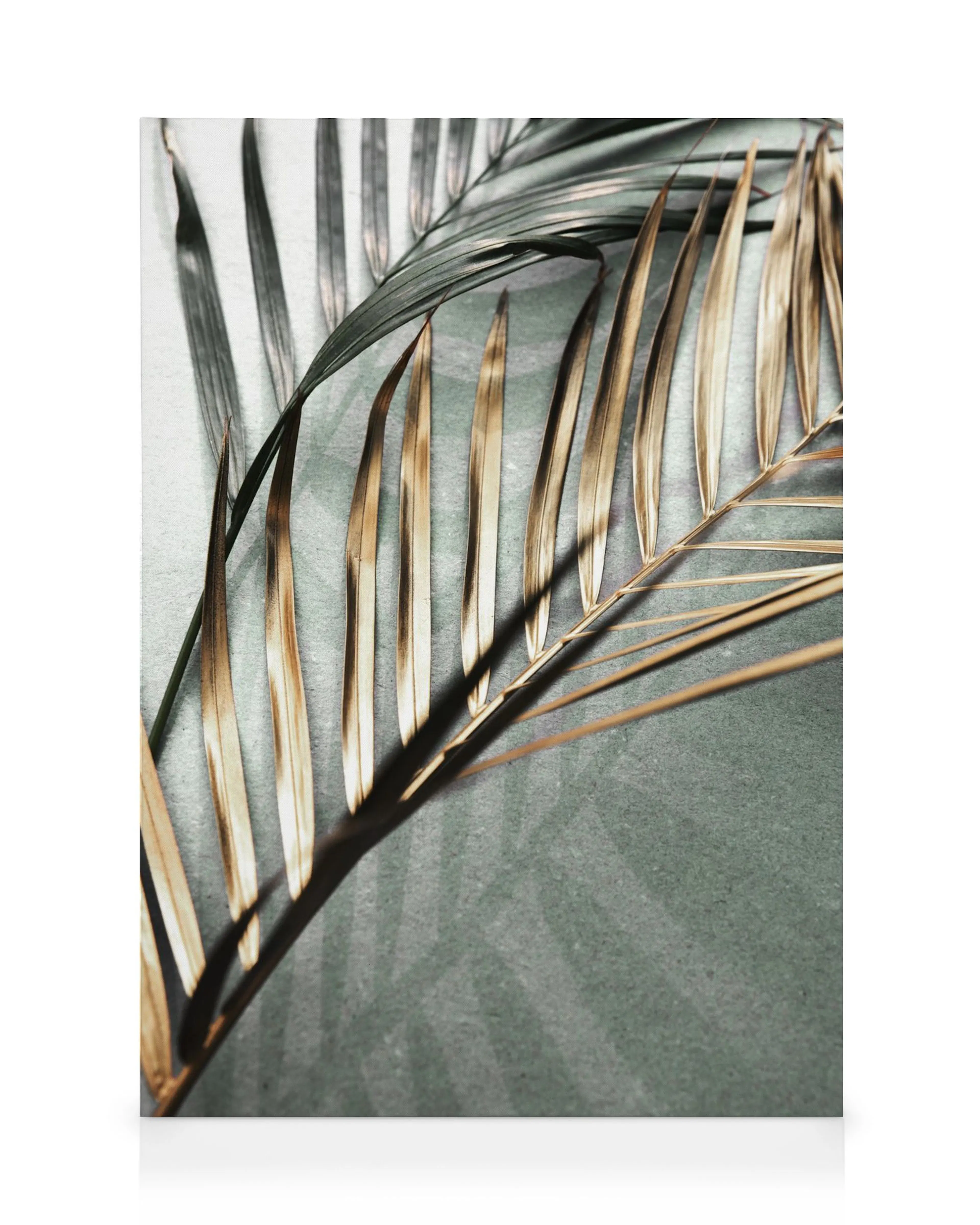 Toile avec une feuille de palmier sombre et dorée sur un fond vert dégradé, texture lisse et détails complexes
