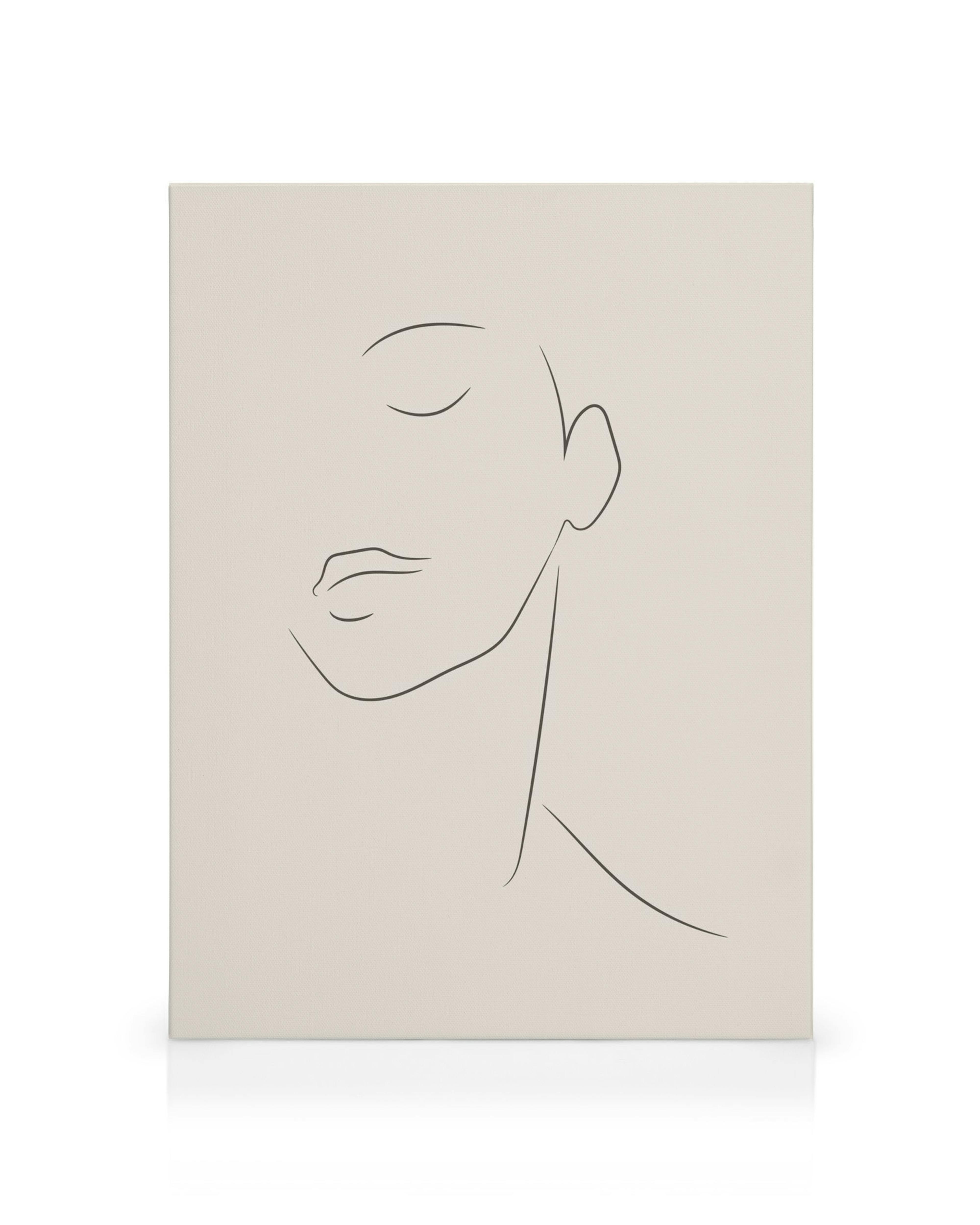 Simple black line art drawing of a serene face with closed eyes on a beige canvas print.