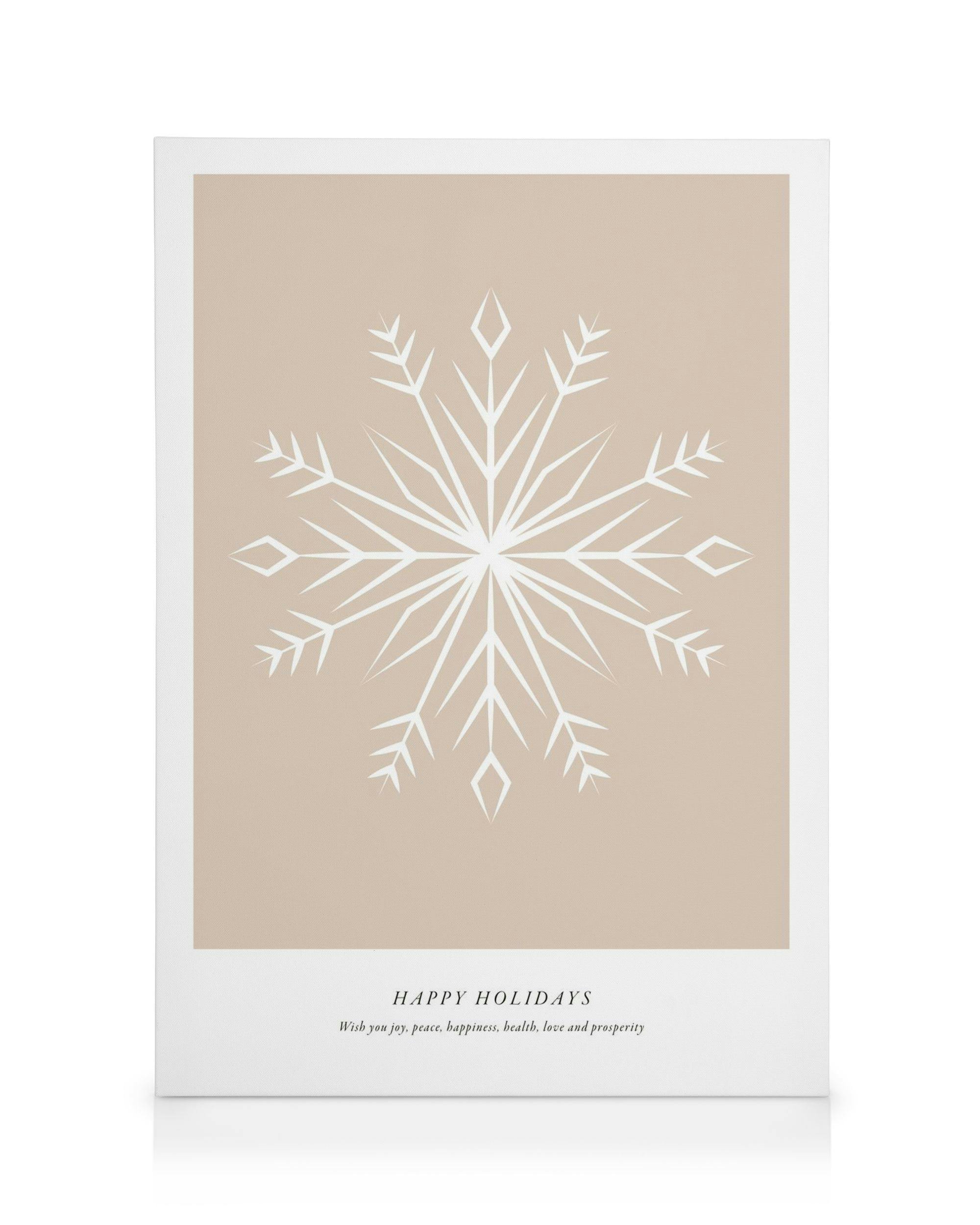 Canvastavla med vit, symmetrisk snöflinga på beige bakgrund, texten Happy Holidays och julhälsning nedtill.