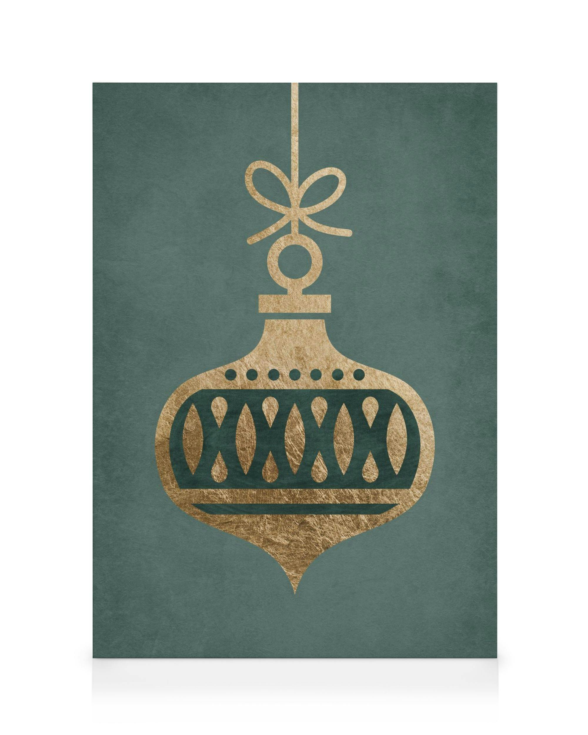 Canvastavla med guldfärgad julkula med rosett och mönster, mot en teal-färgad bakgrund. Festlig konst.