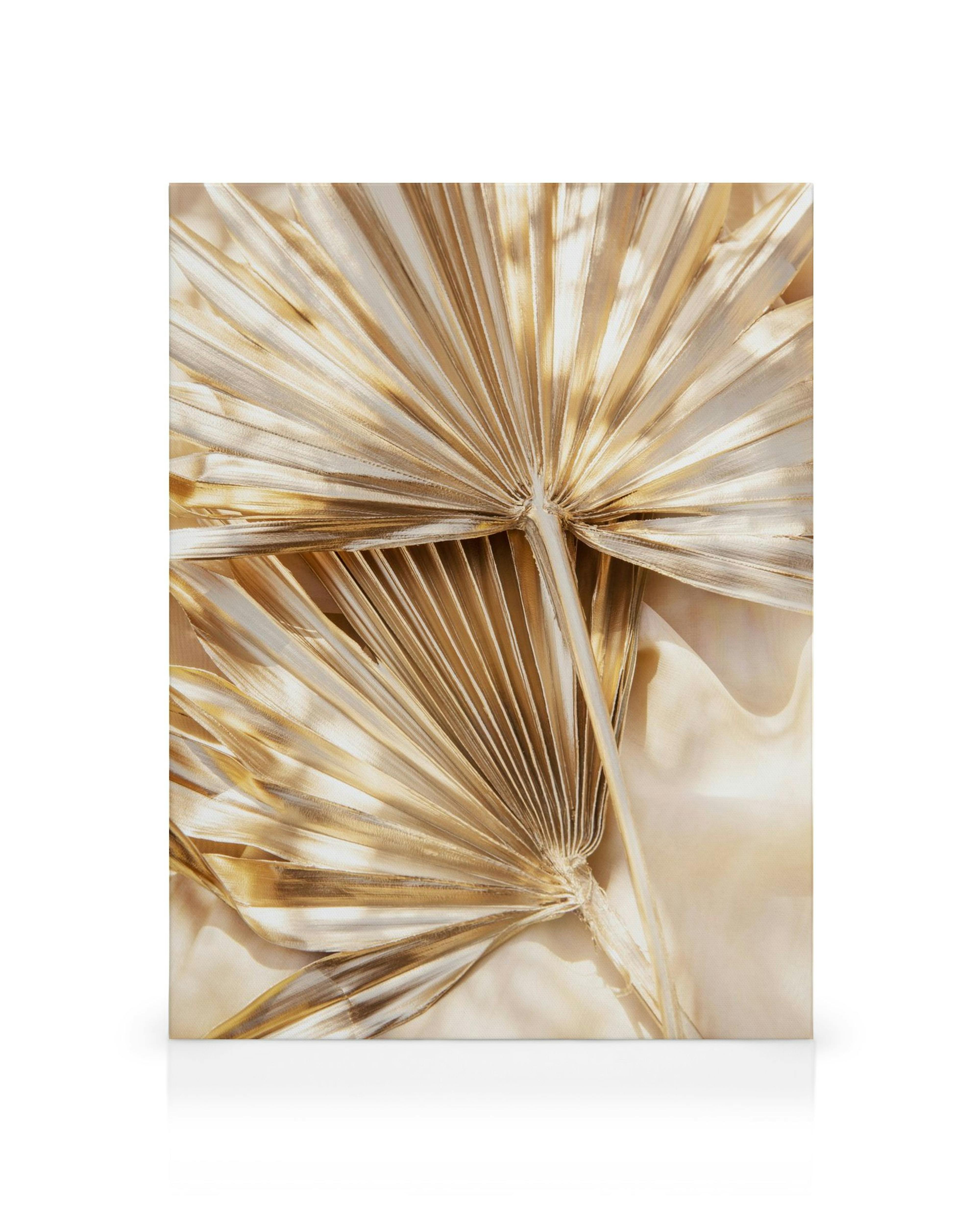 Obraz na plátne: zlaté listy palmy, sýte farby a lesklý povrch, moderné umenie.