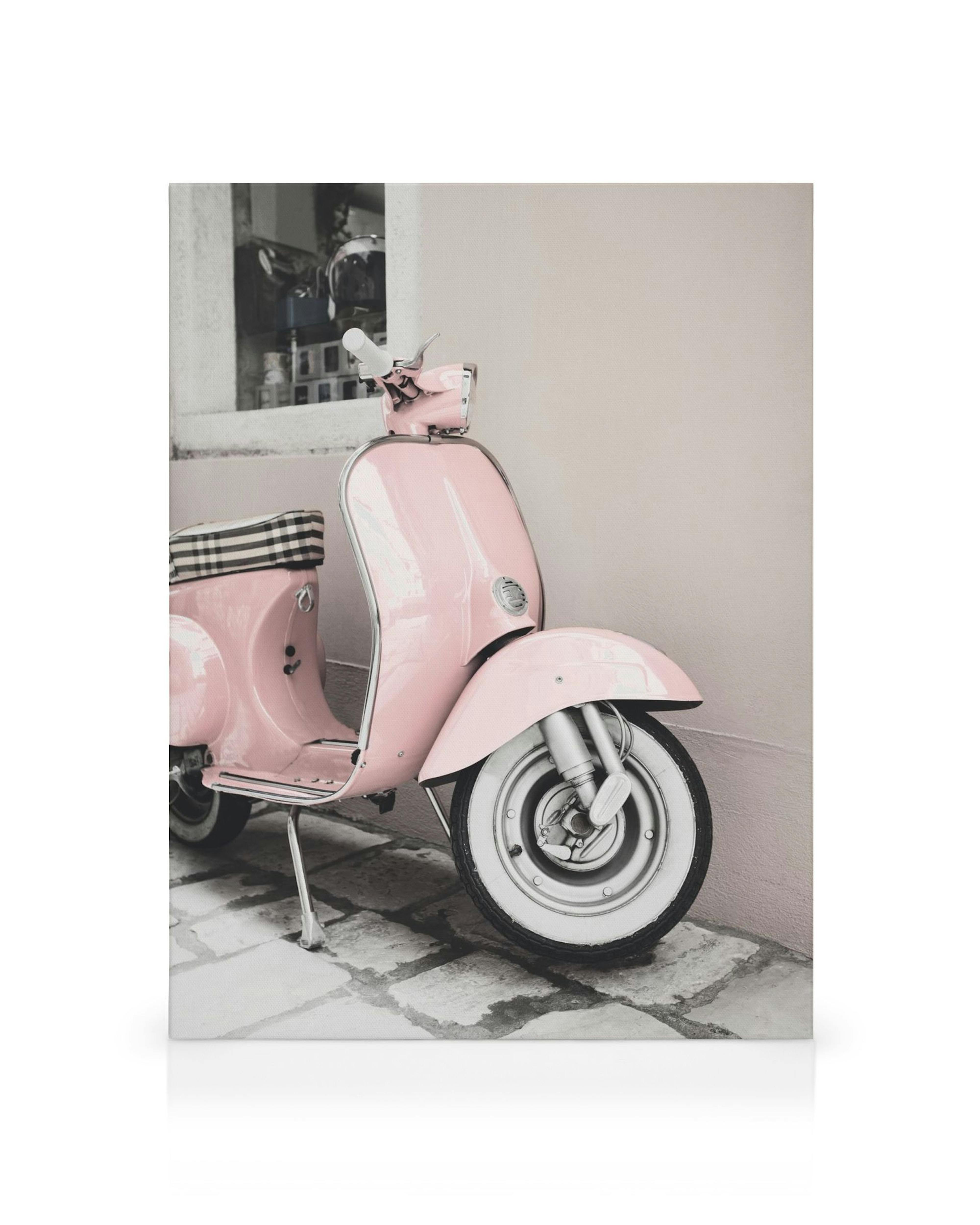 Pink scooter parked against a beige wall, a charming canvas print for wall decor.