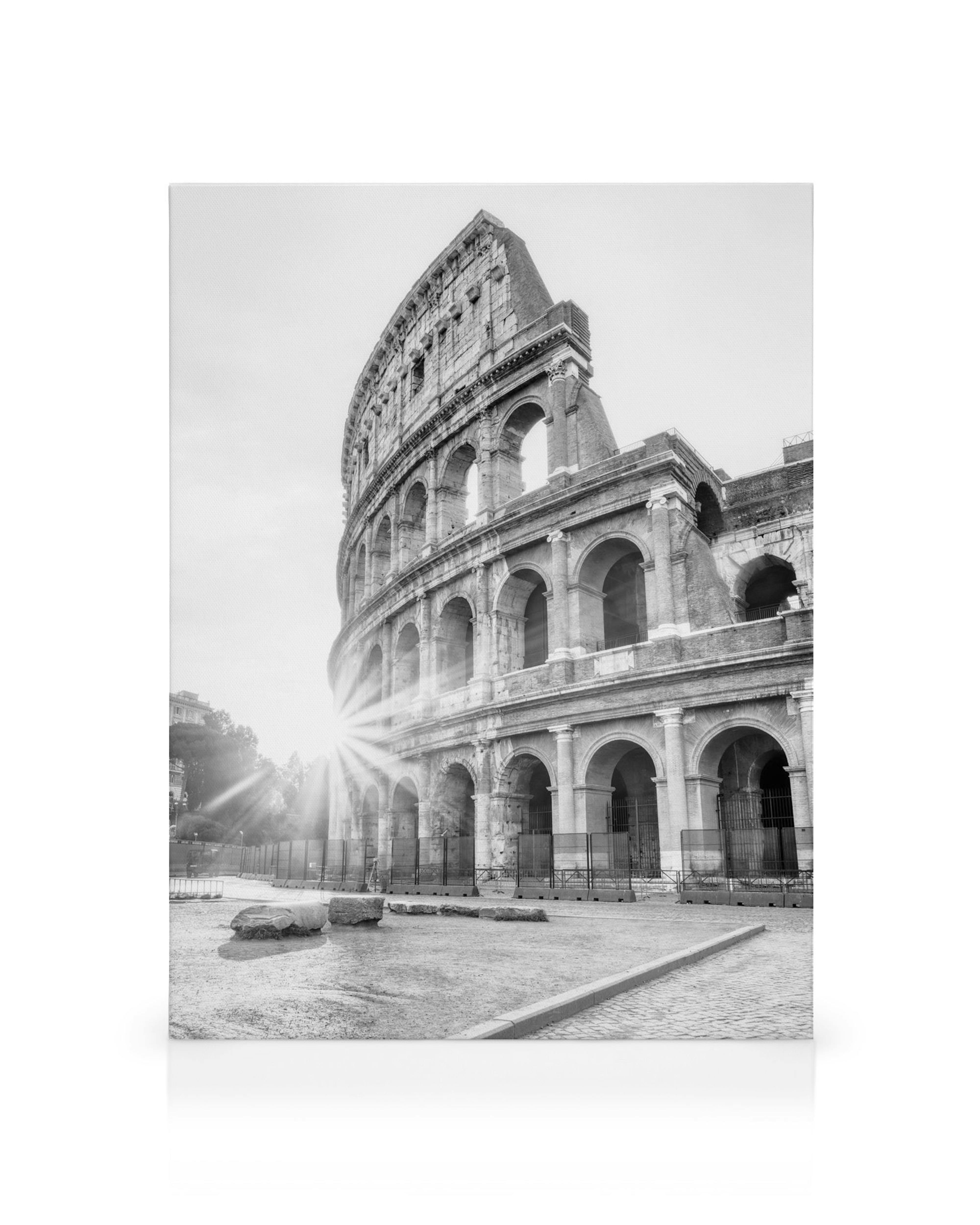 Black and white Colosseum canvas print with sun rays, historical Roman architecture.