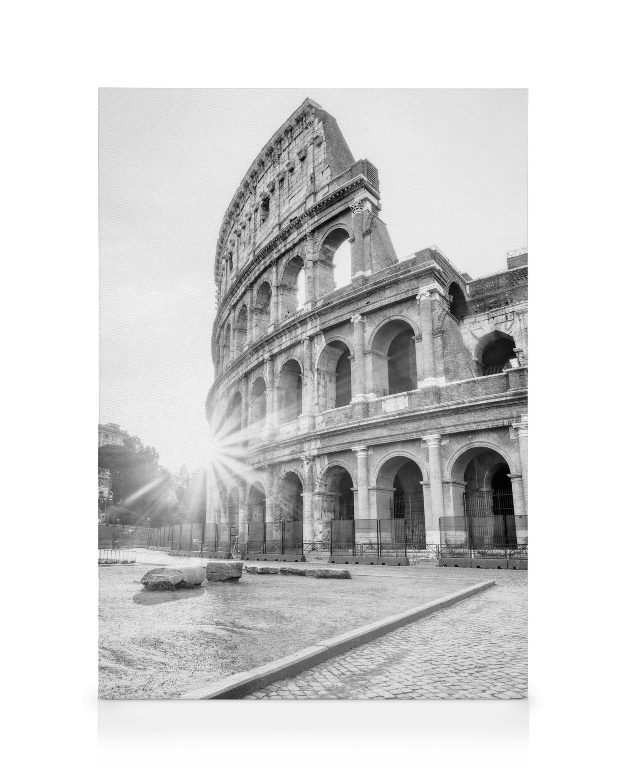 Black and white Colosseum canvas print with sun rays, historic Rome architecture, and ancient stone details.