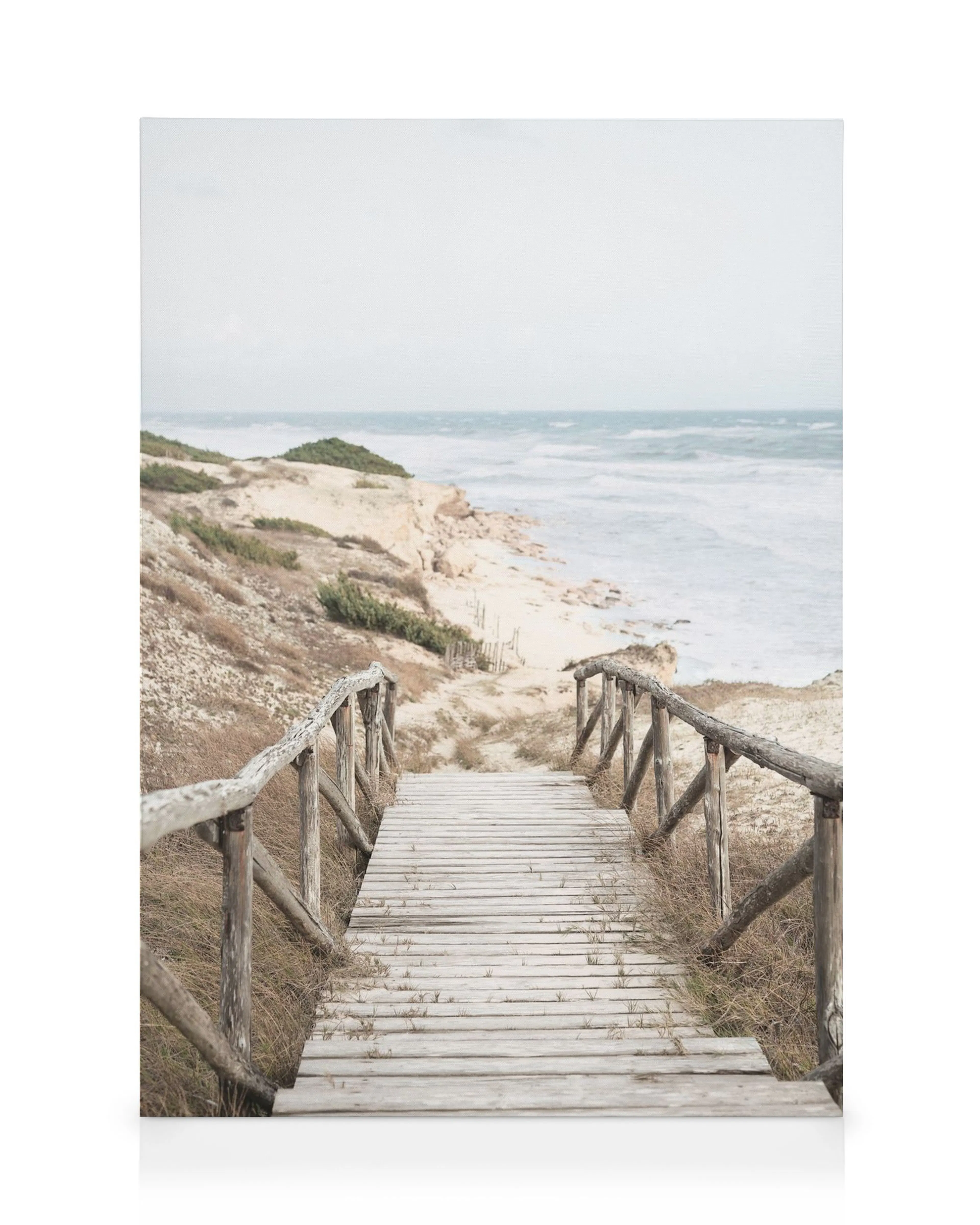 Hamptons beach boardwalk canvas print of a wooden walkway leading to a sandy beach and sea, with grass and dunes.