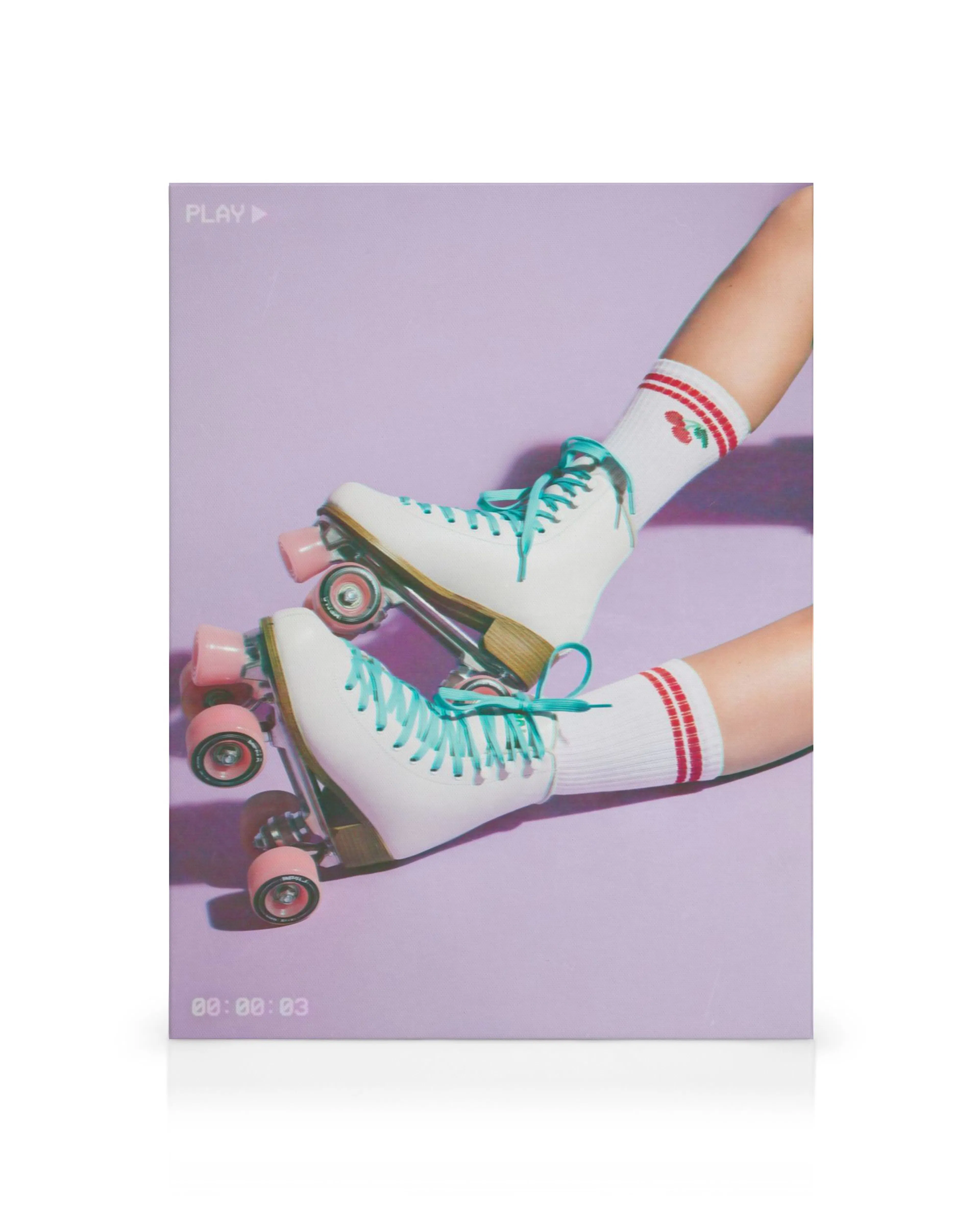 Vibrant roller skate canvas print with white skates, teal laces, pink wheels, and cherry socks on a lavender background.