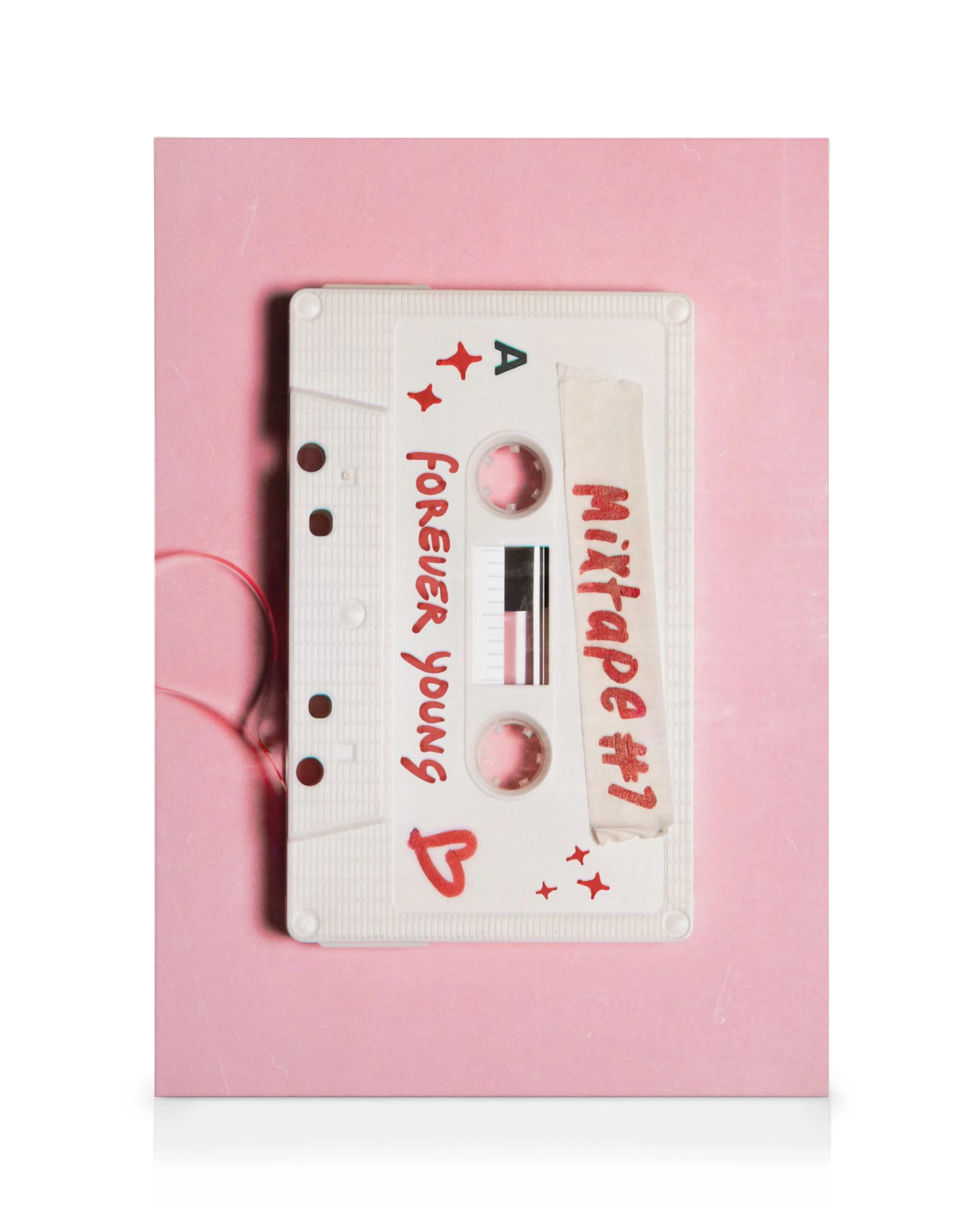 Pink canvas print featuring a white cassette tape with red stars and heart, titled Mixtape #1 Forever Young.