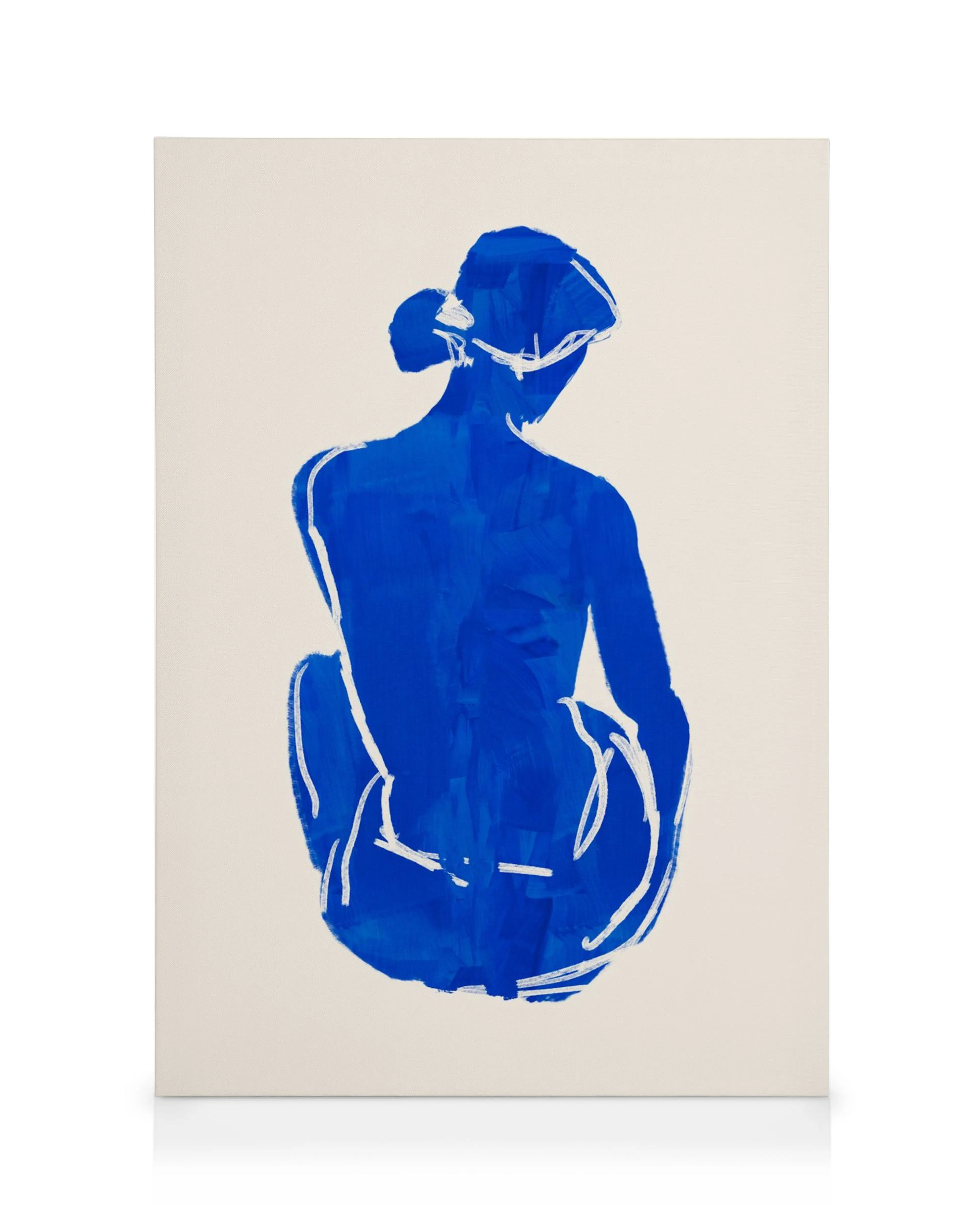Abstract blue brushstroke figure on white background, a unique canvas print of a seated person from behind