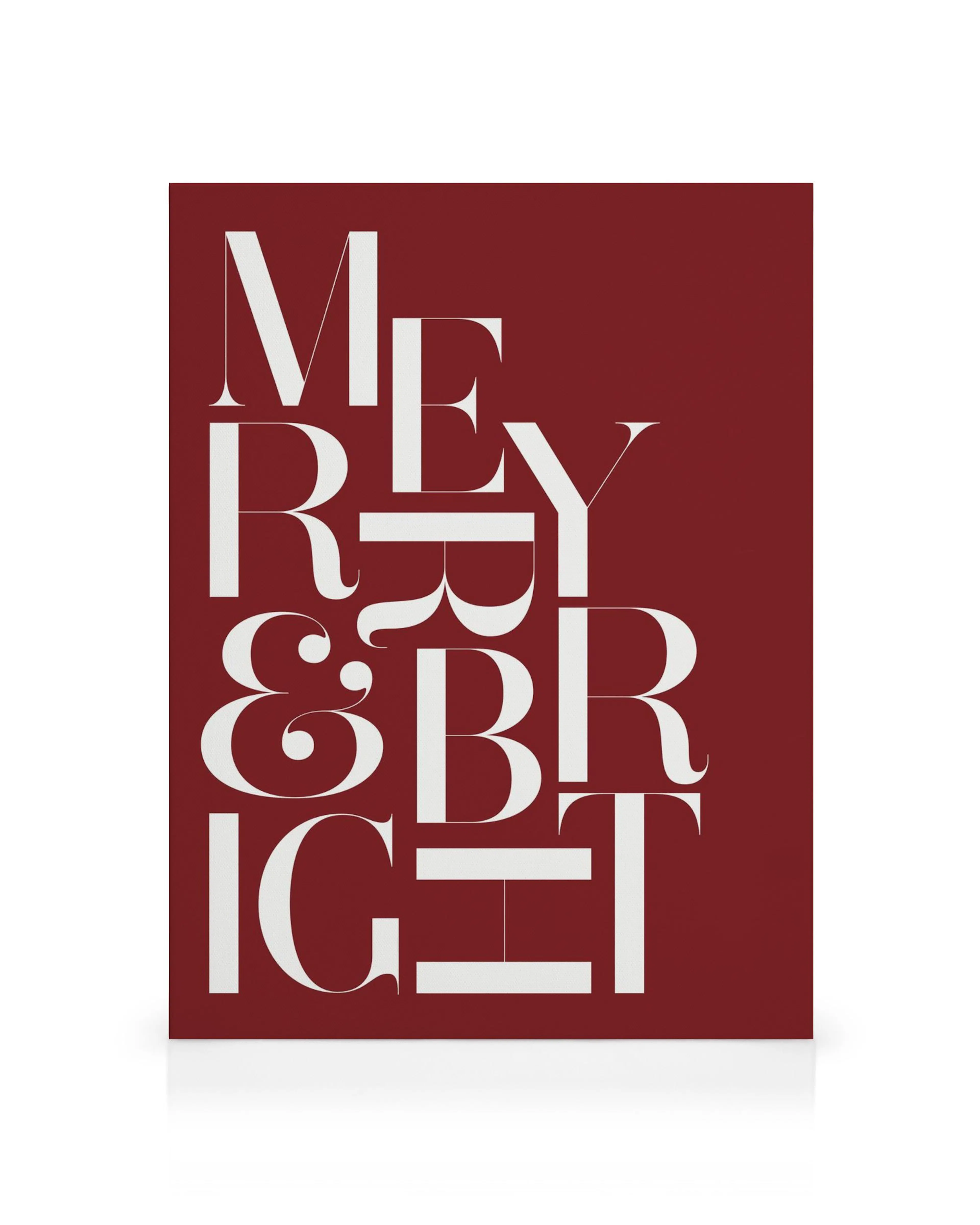 Merry and Bright typographic canvas print with white serif font on a deep red background, festive home decor.