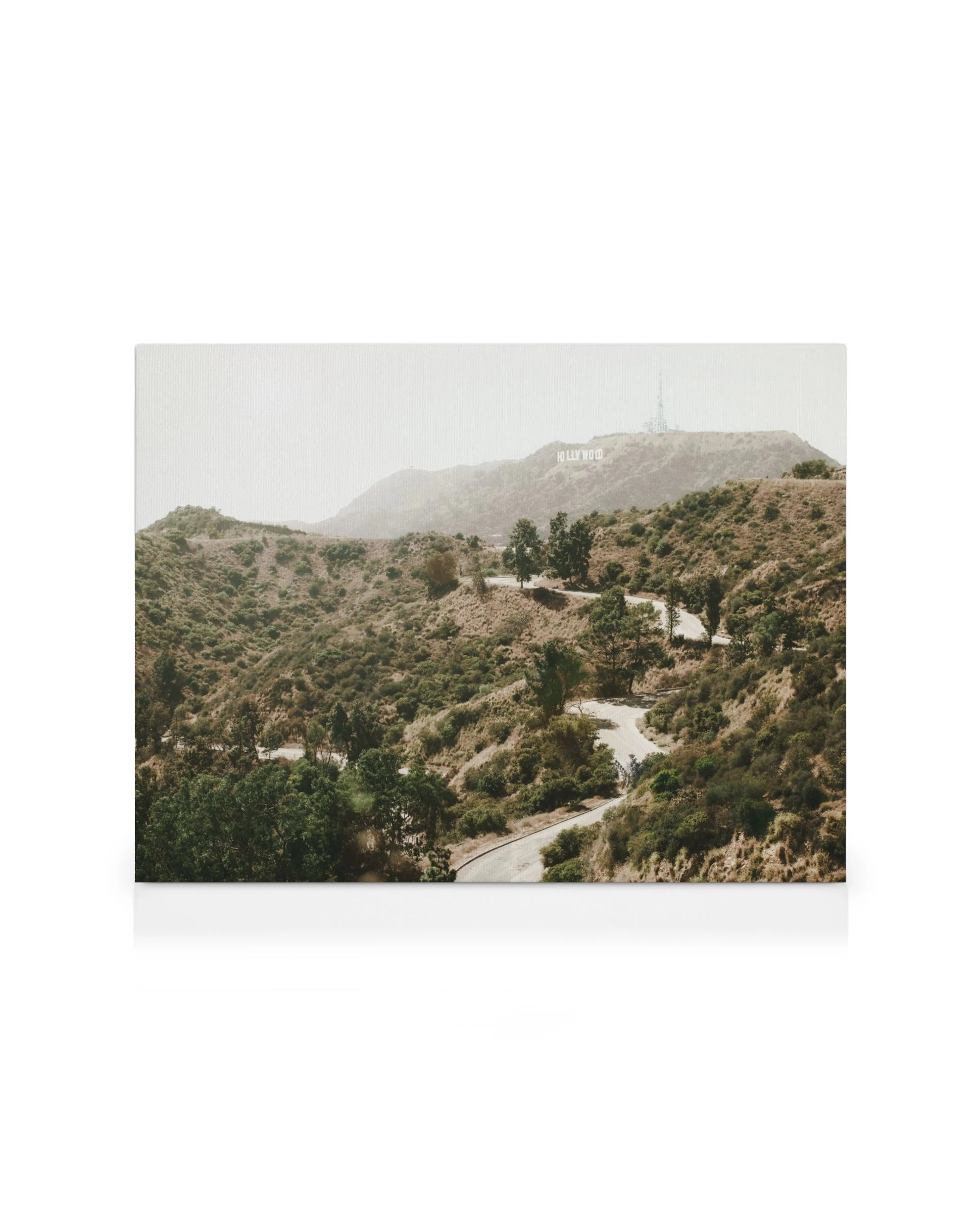 Winding road through Hollywood Hills, iconic sign visible in background, a scenic landscape canvas print.