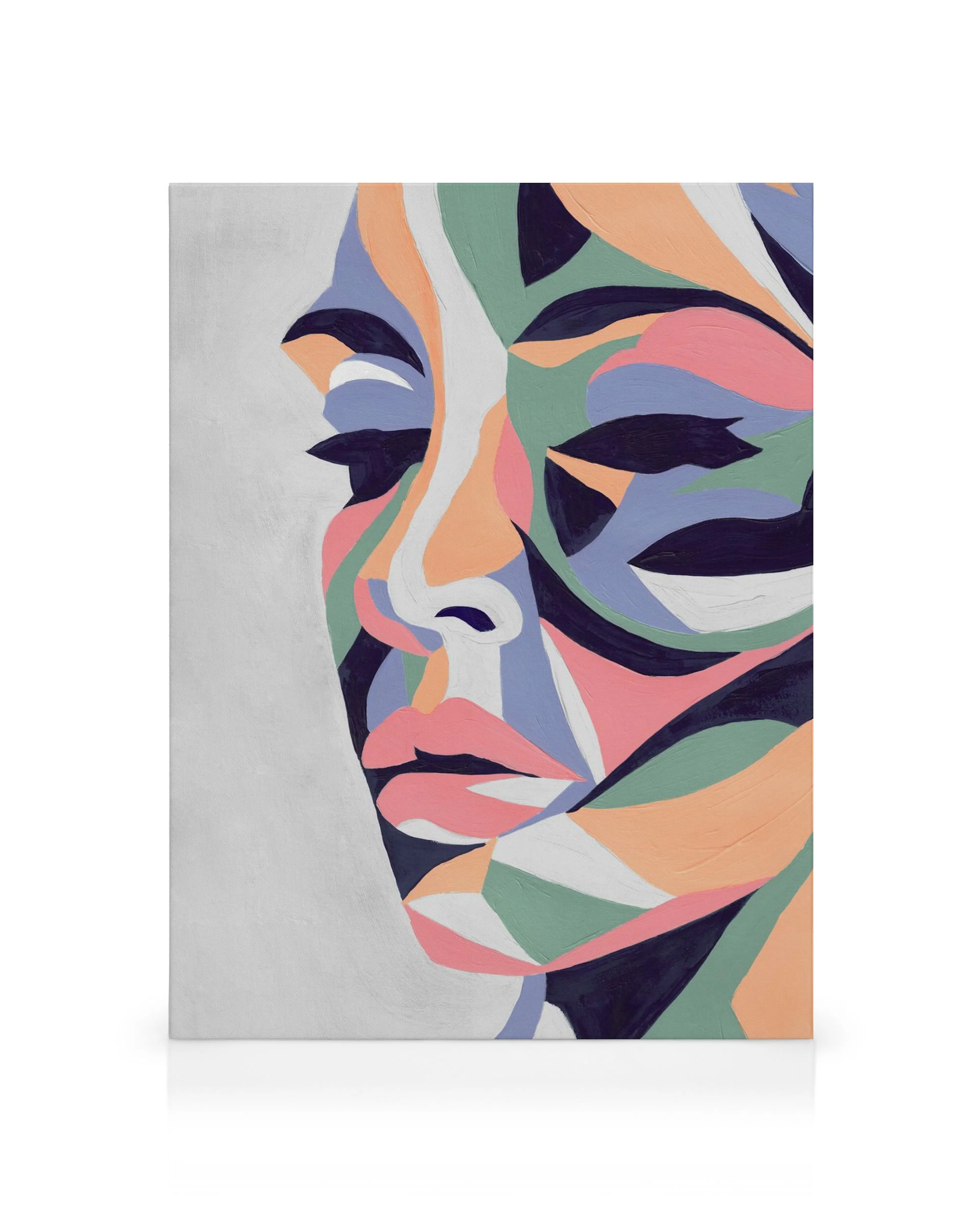 Colorful abstract portrait canvas print of a face with green, blue, pink, orange, black, and white shapes.