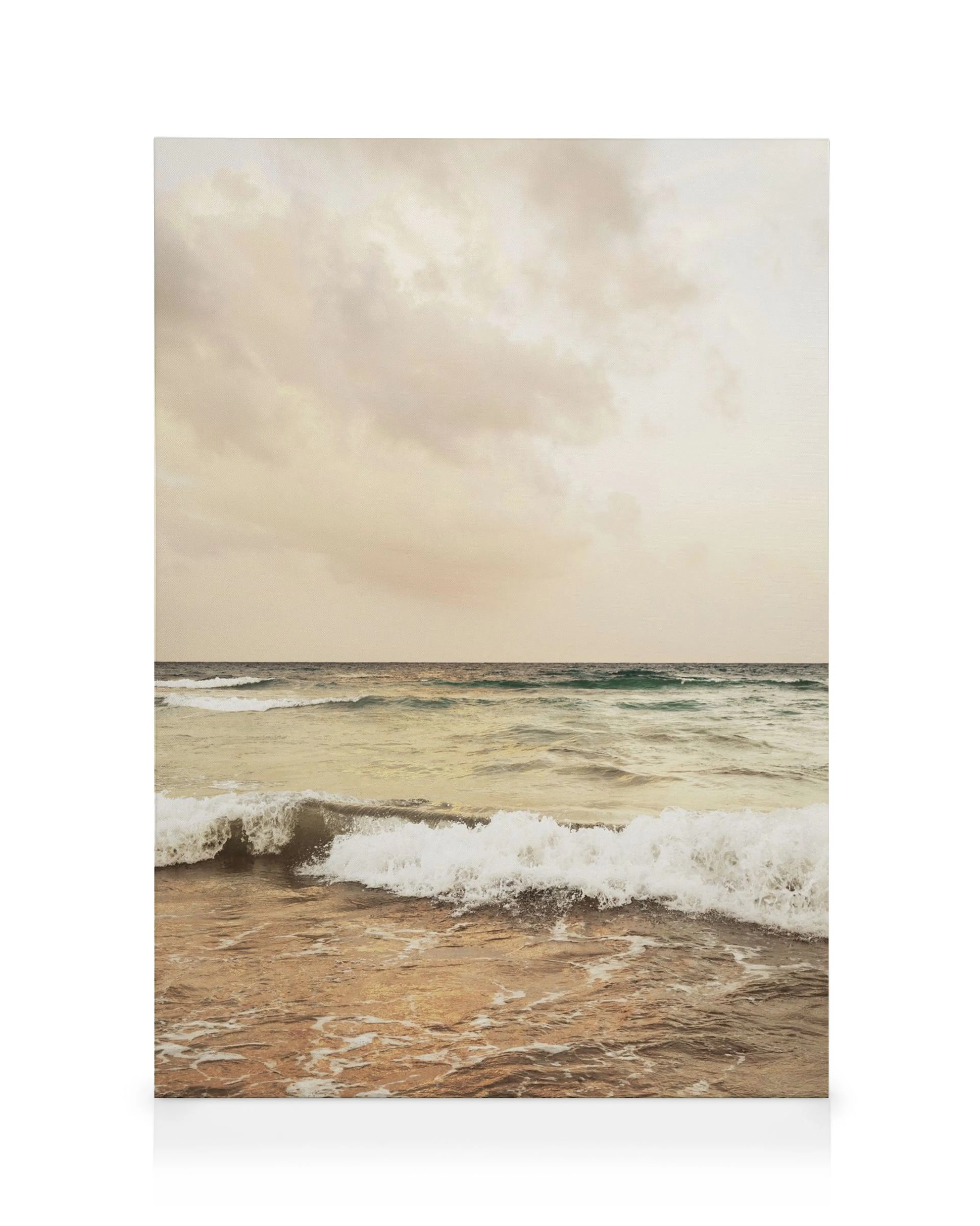 Sunset Horizon canvas print with blue and white waves on light brown sand, under a cloudy white and grey sky.