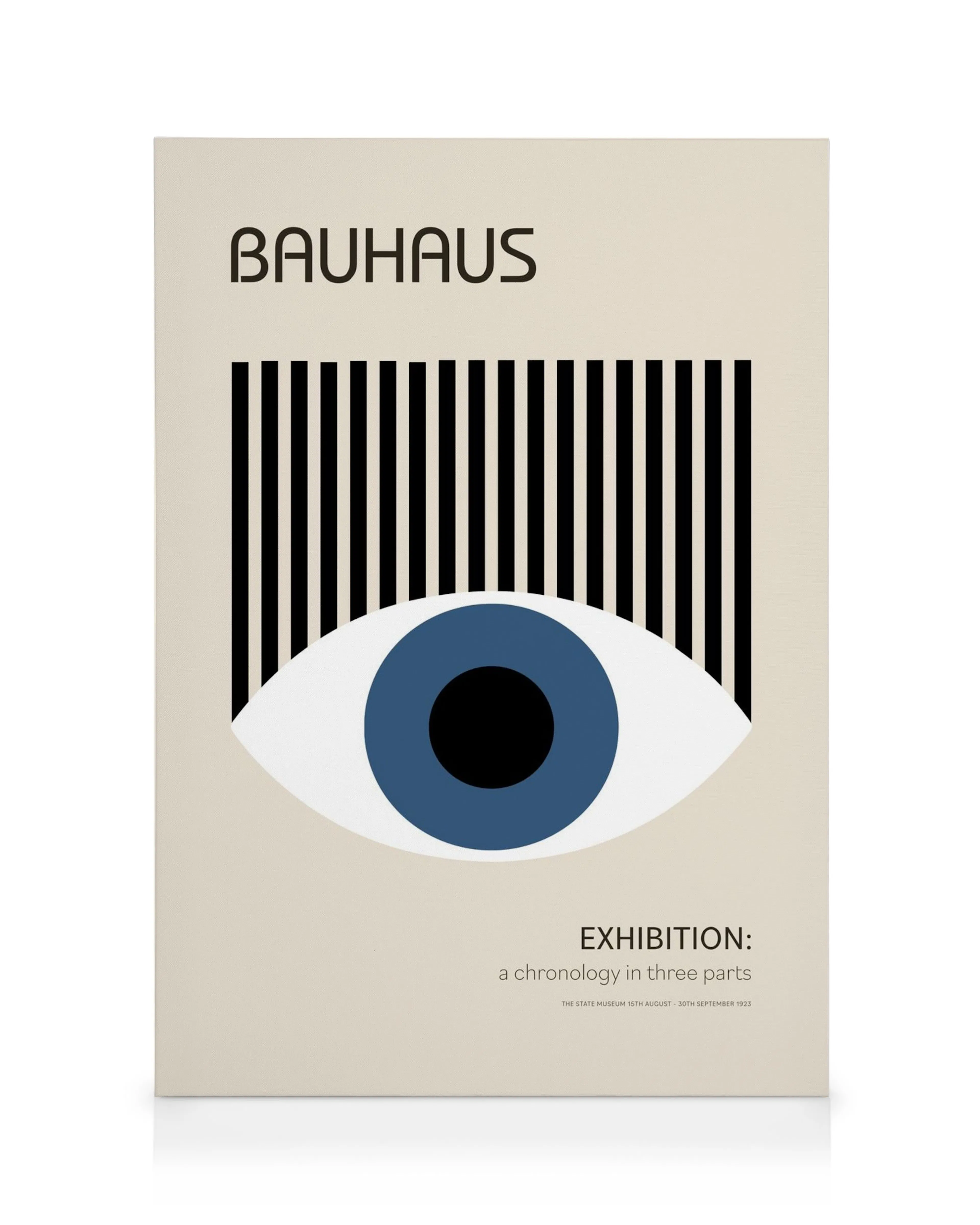 Bauhaus-lerret med blå iris, svarte øyenbryn og BAUHAUS-tekst på beige bakgrunn.