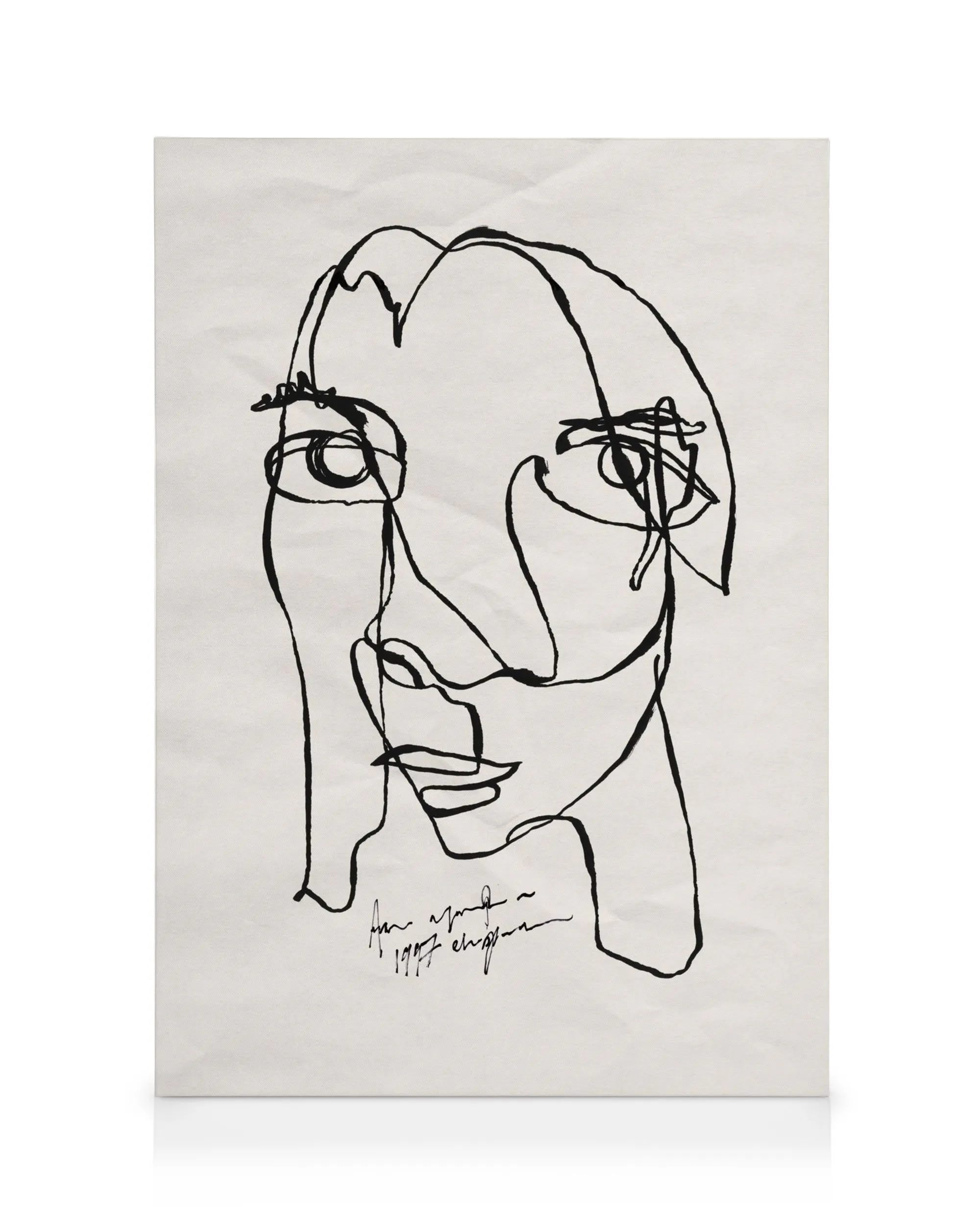 Abstract black line art portrait on a white canvas print, featuring a face with minimalist facial features.