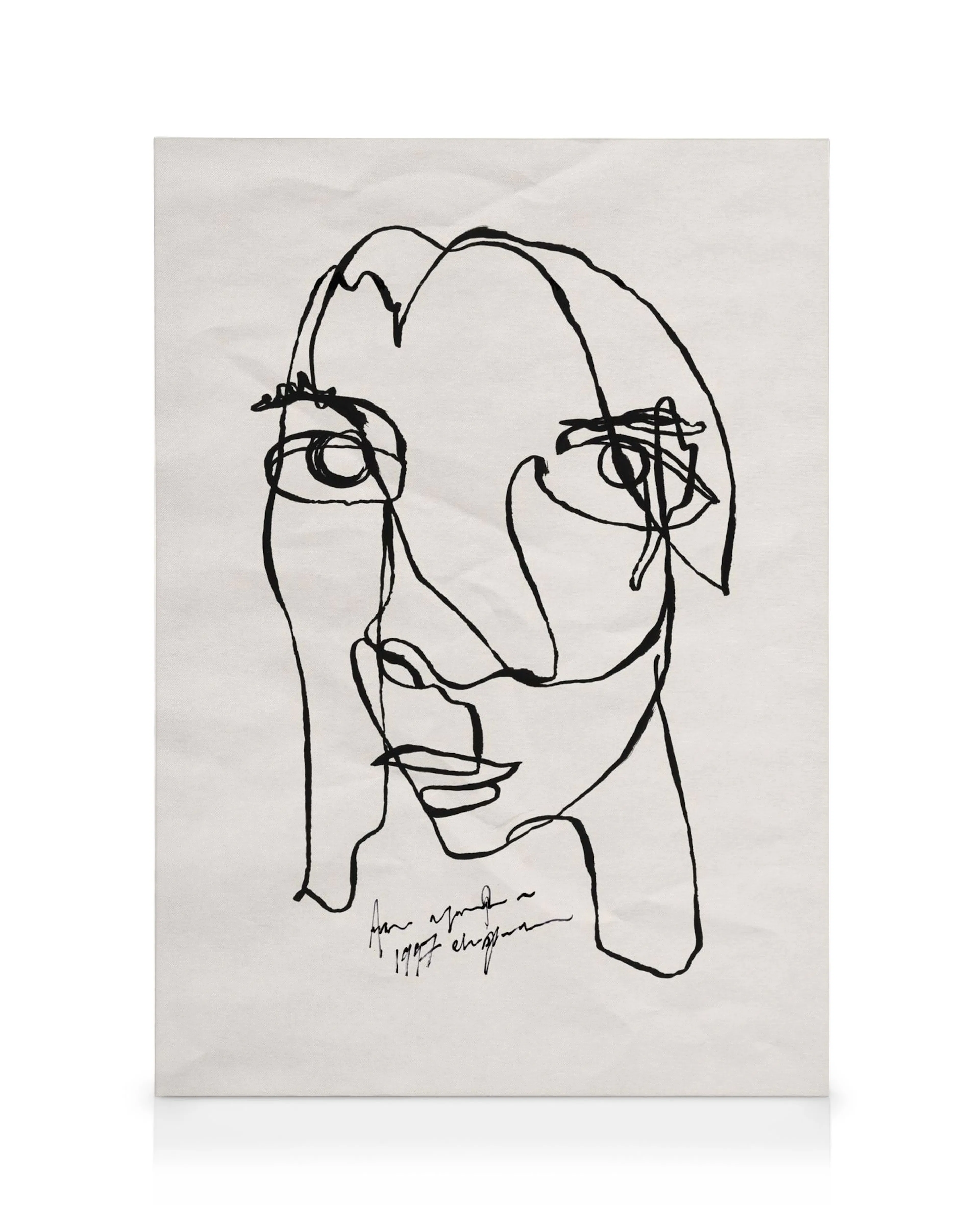 Abstract black line art portrait on a white canvas print, featuring a face with minimalist facial features.