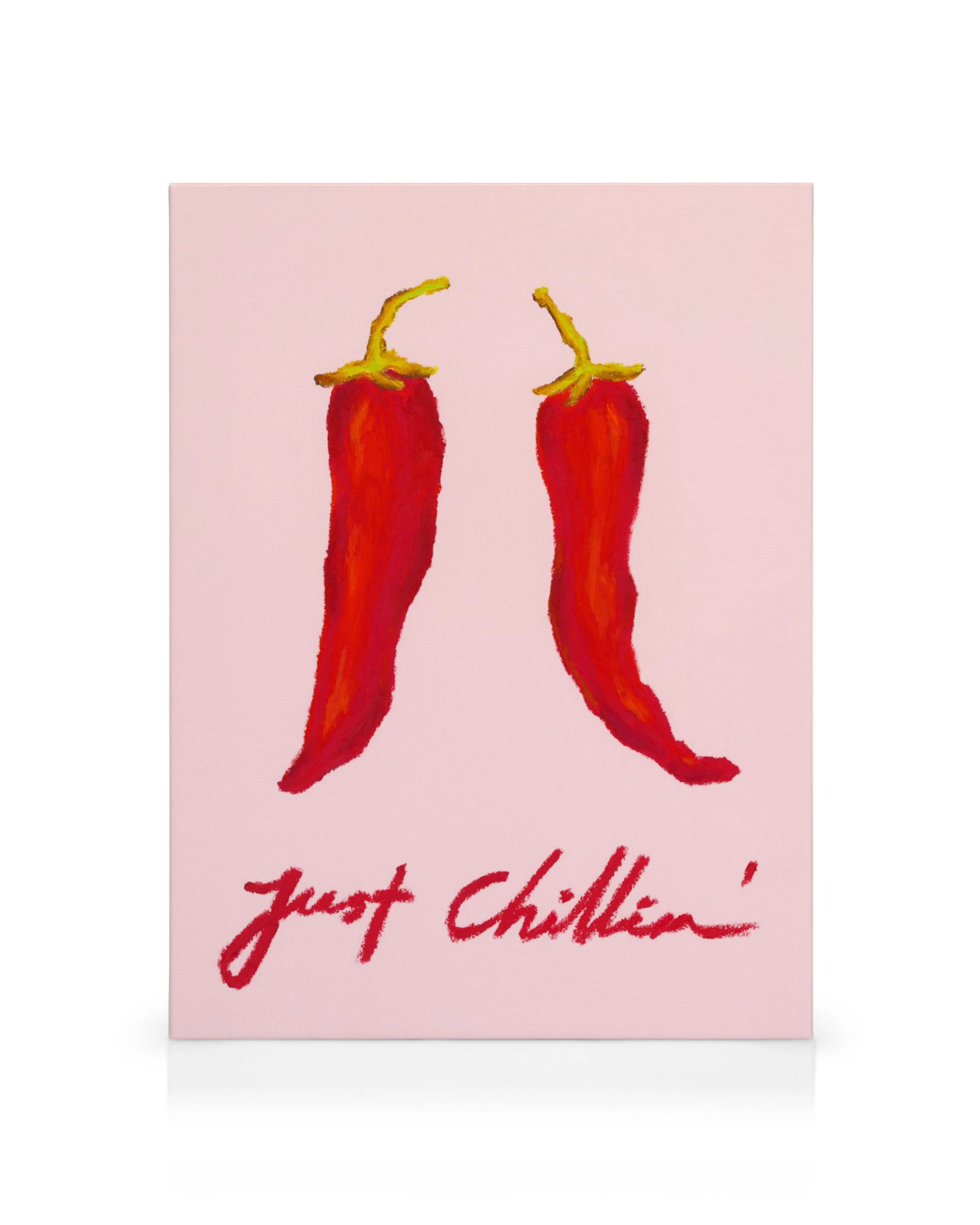 A fun canvas print featuring two red chili peppers on a pink background with the text, Just Chillin.