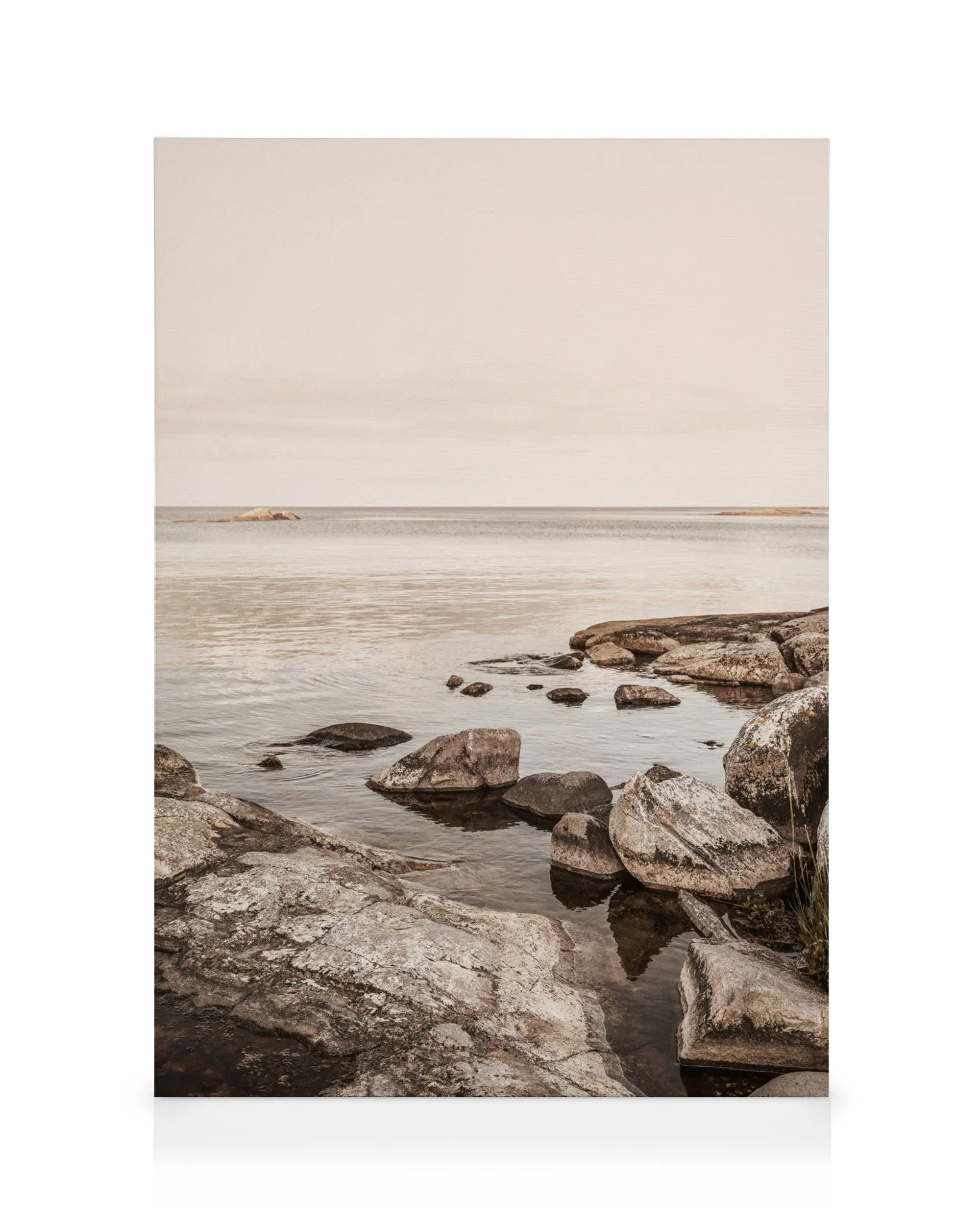 Calm Coast Canvas print featuring a serene rocky coastline at dusk, ideal for minimalist decor.
