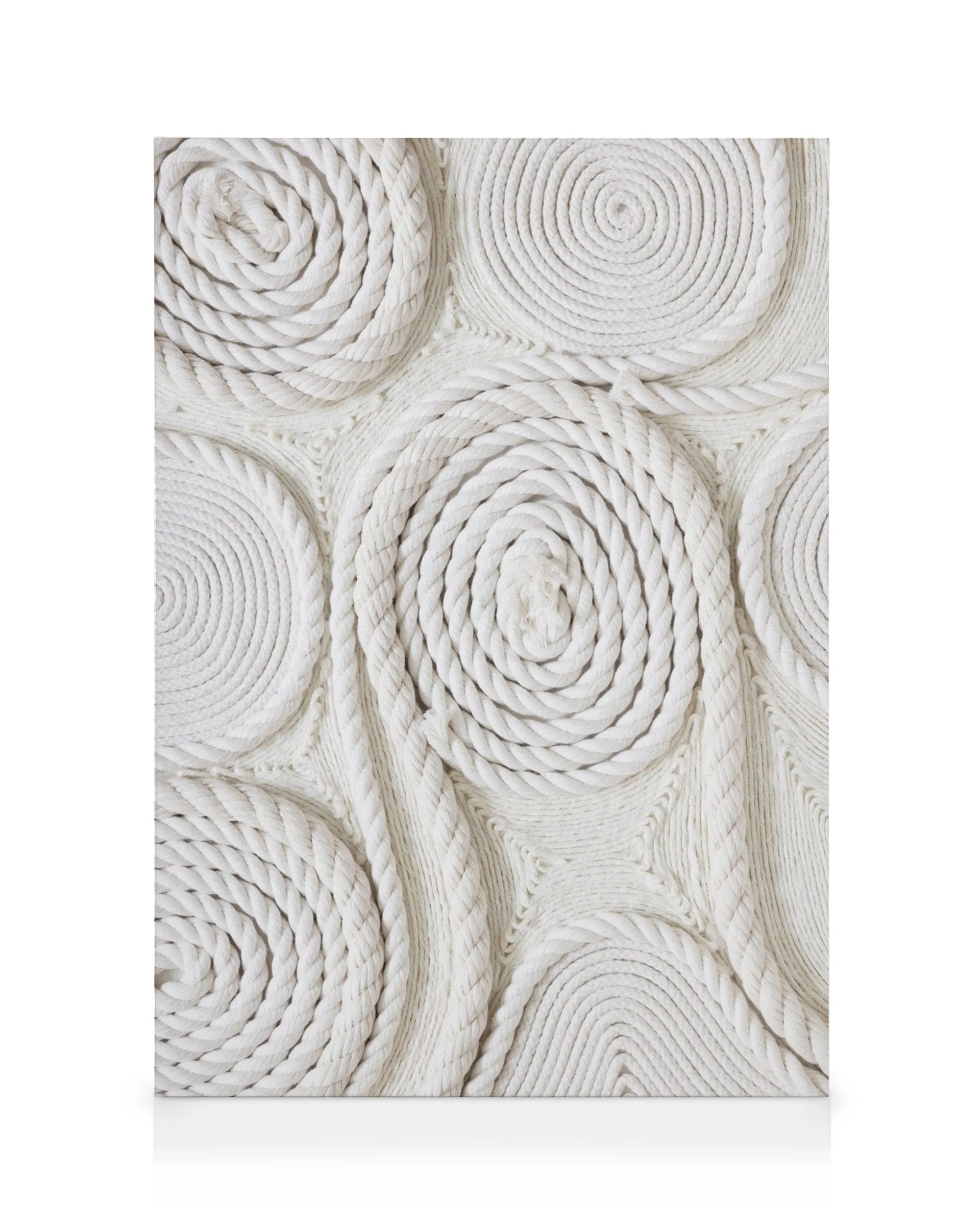 White canvas art featuring coiled rope circles and wavy rope lines, creating a textured, geometric pattern.