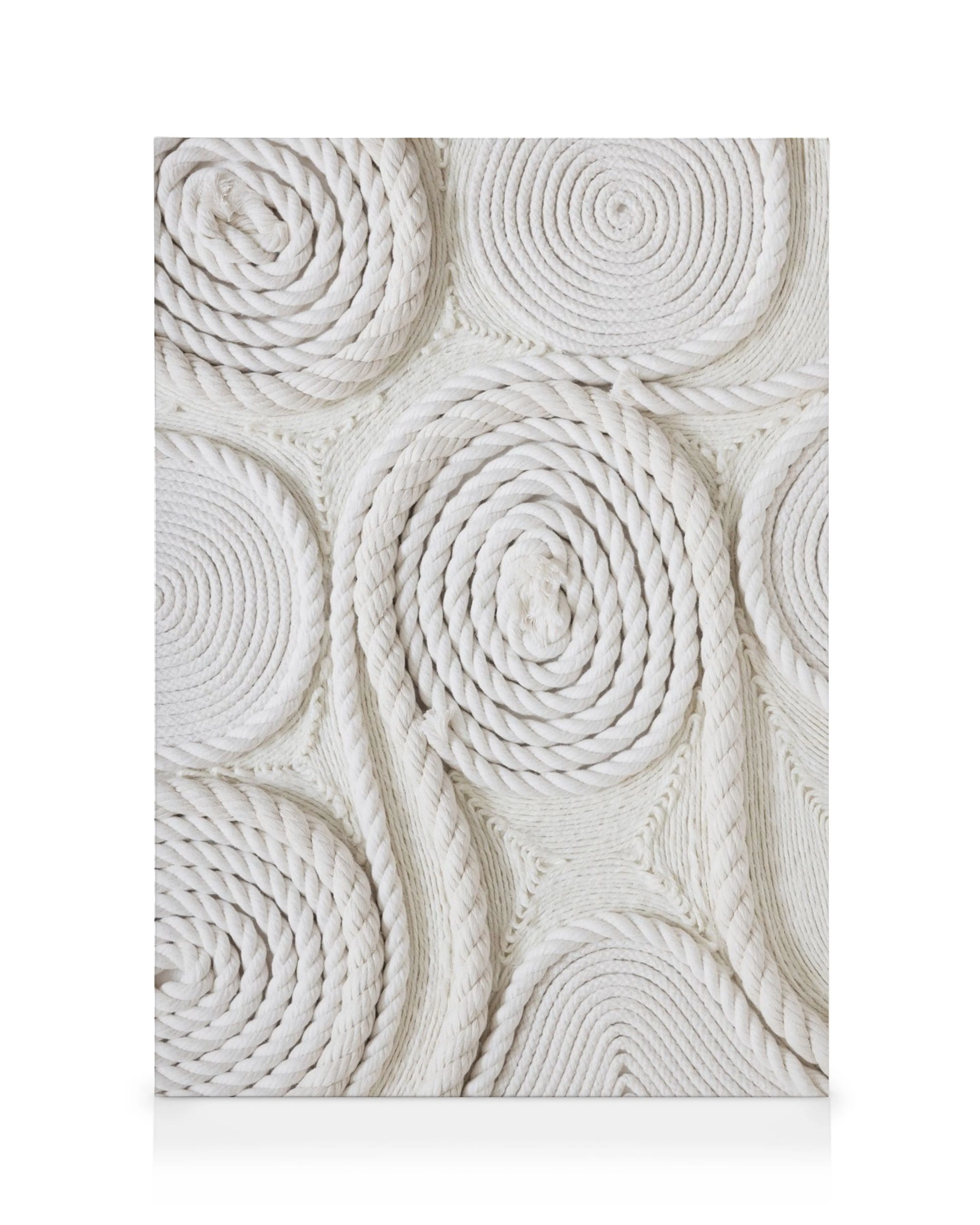 White canvas art featuring coiled rope circles and wavy rope lines, creating a textured, geometric pattern.