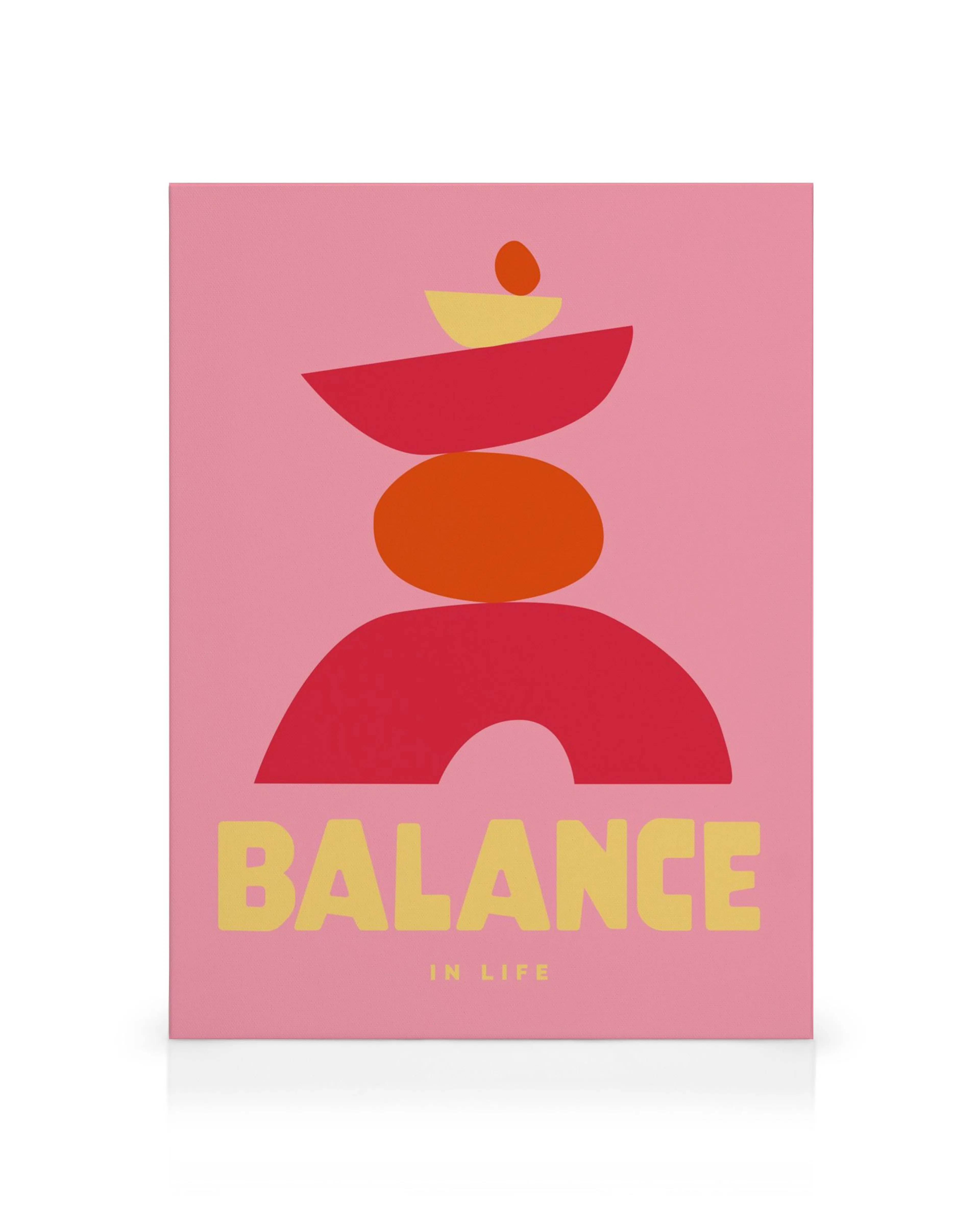 Graphic abstract canvas print with stacked red, orange, and yellow shapes on pink, BALANCE text below.
