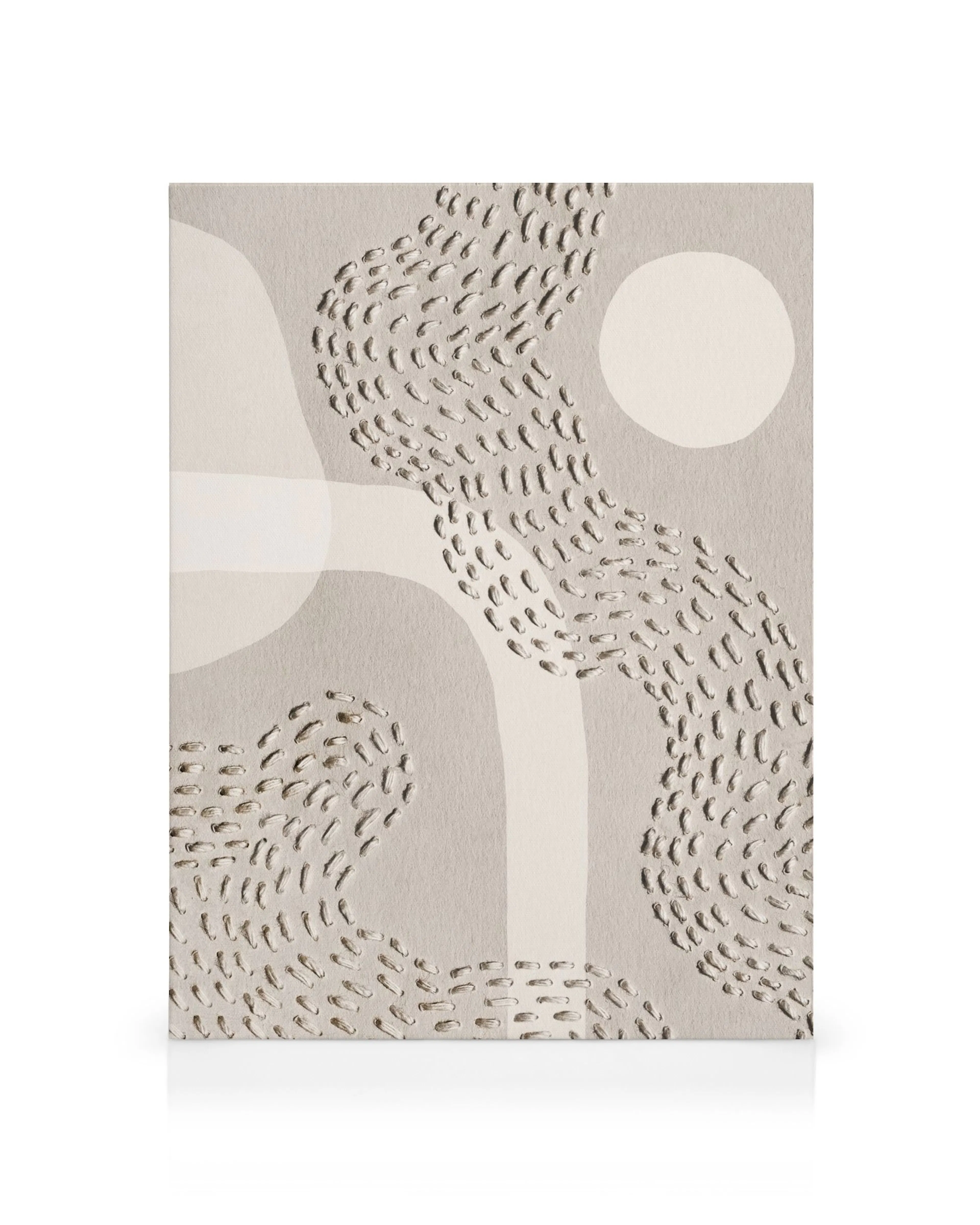 Abstract canvas print with overlapping beige and white shapes, curved lines, and dots on a textured background.
