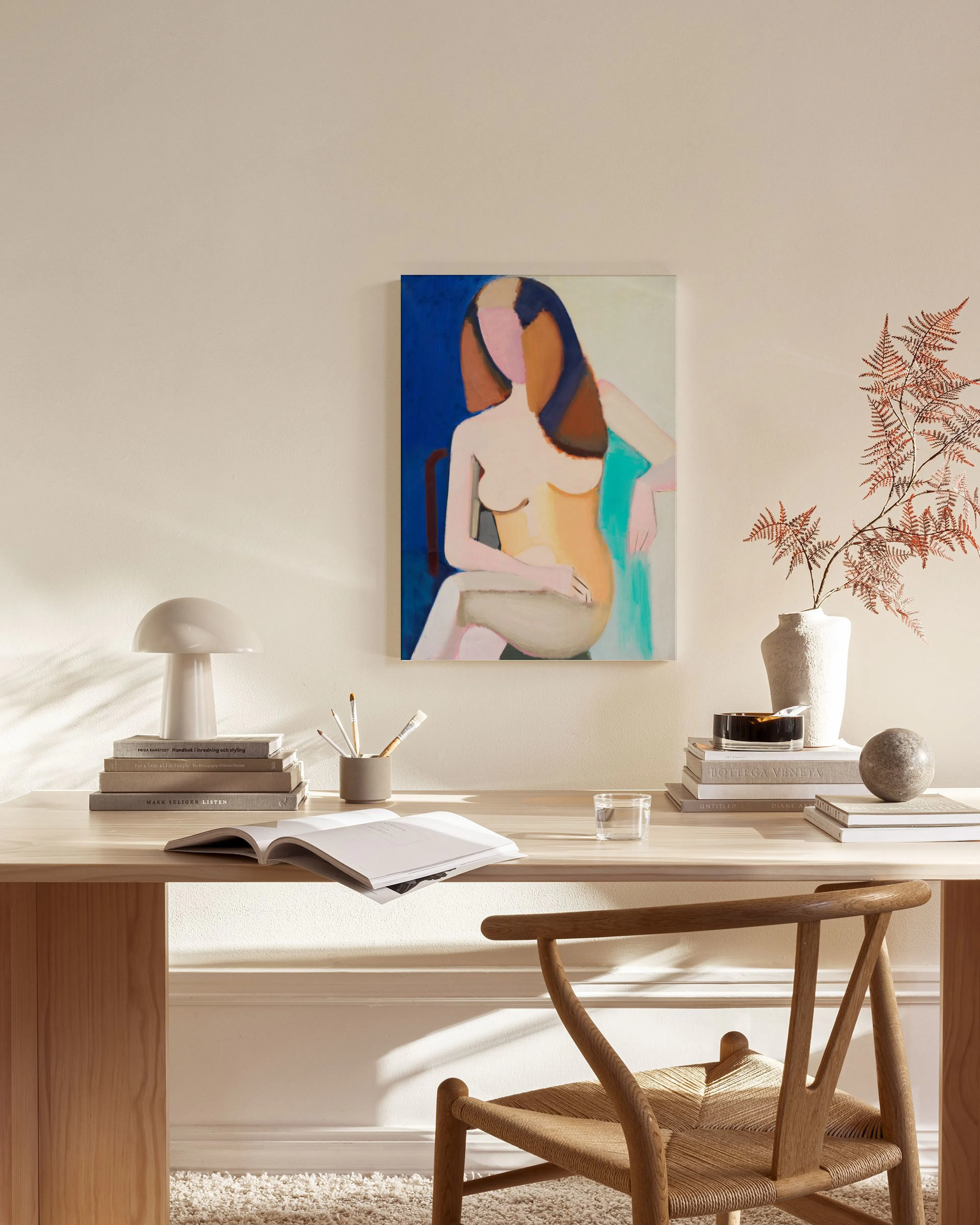 A colourful figure study of a seated woman with long hair, in a modern living room with a light beige rug and wooden furniture.