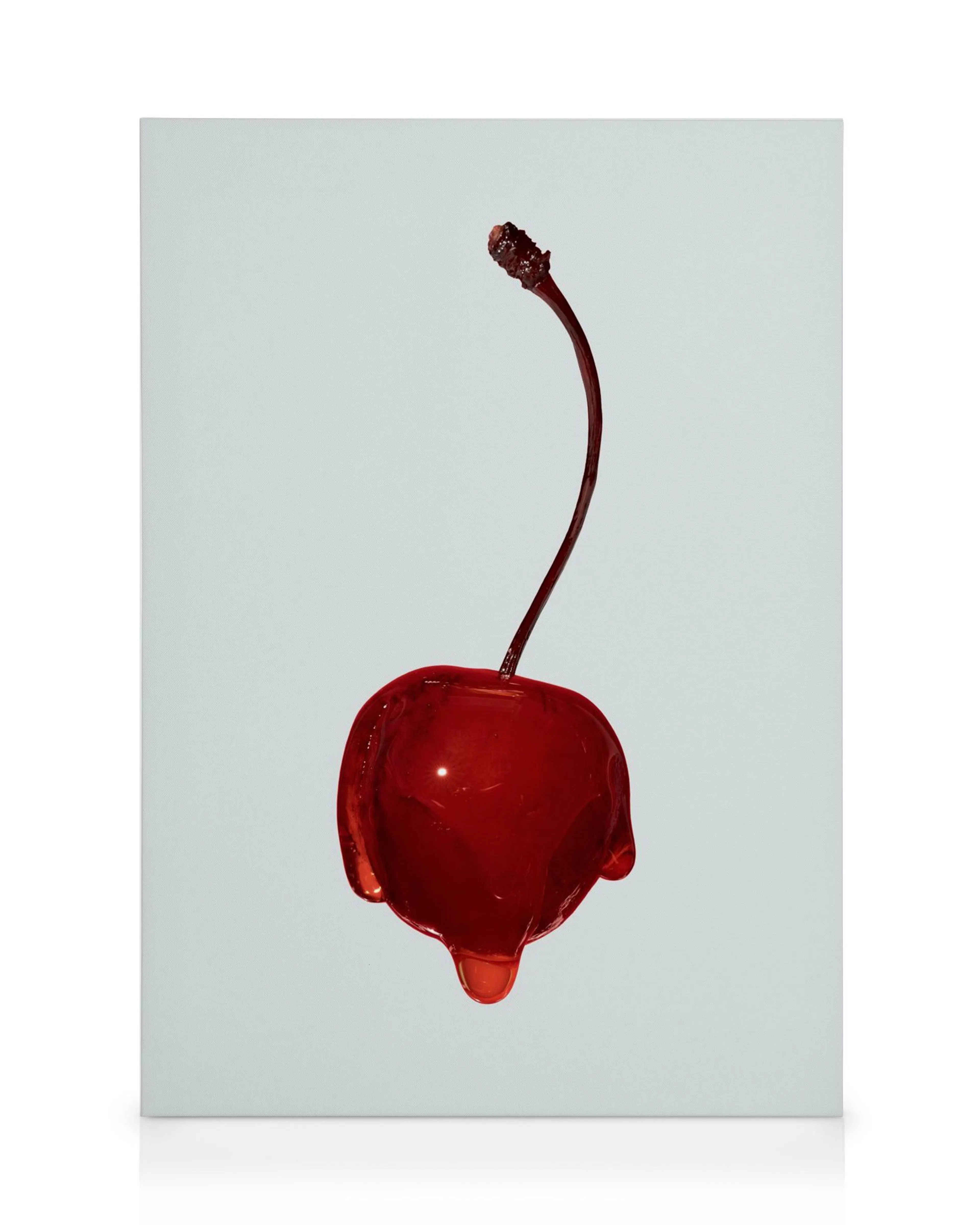 A canvas print featuring a vibrant red, glossy cherry with a long stem and a drip of liquid at the bottom.