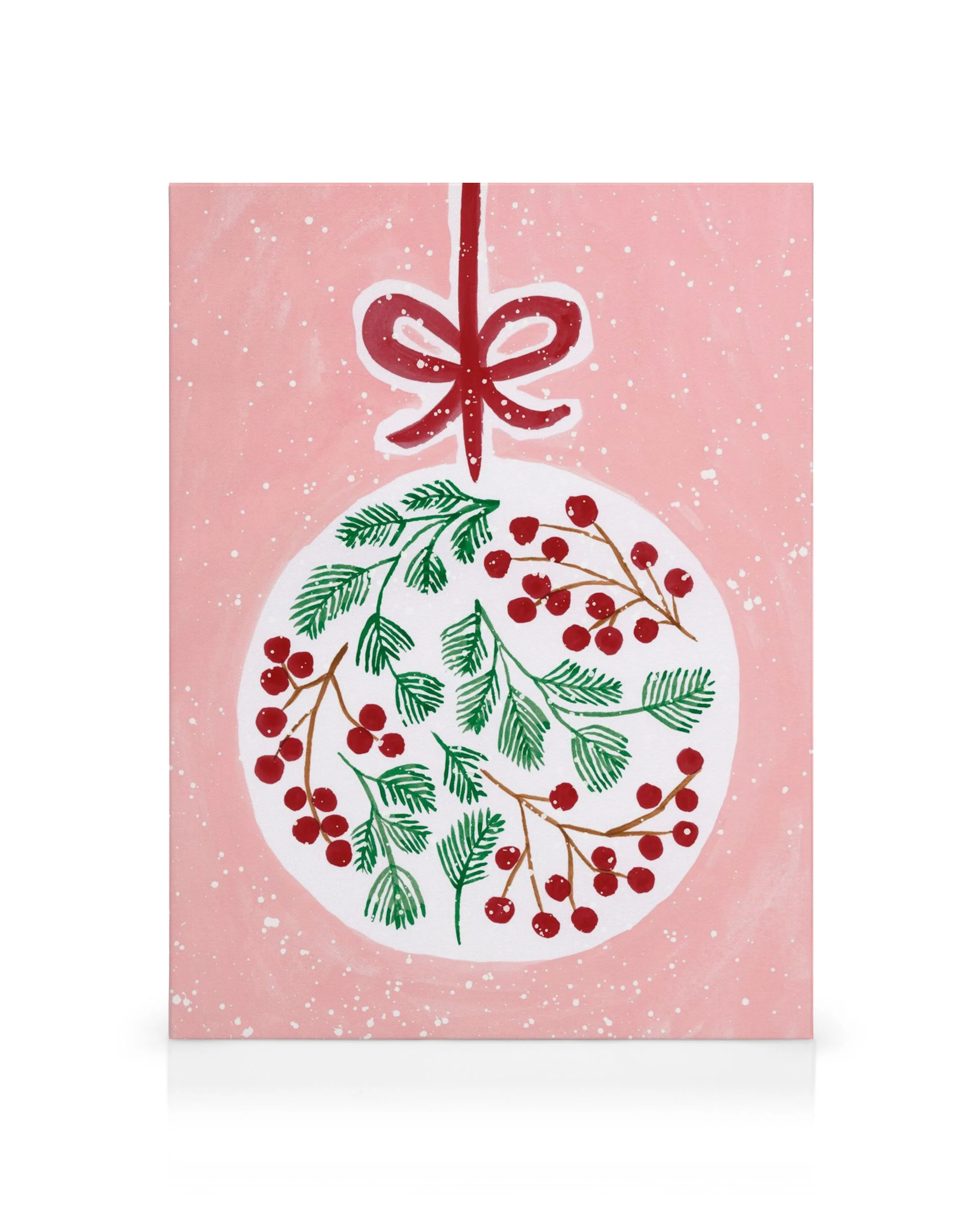Festive canvas print featuring a white Christmas ornament with green pine branches and red berries, hanging from a red bow on a 