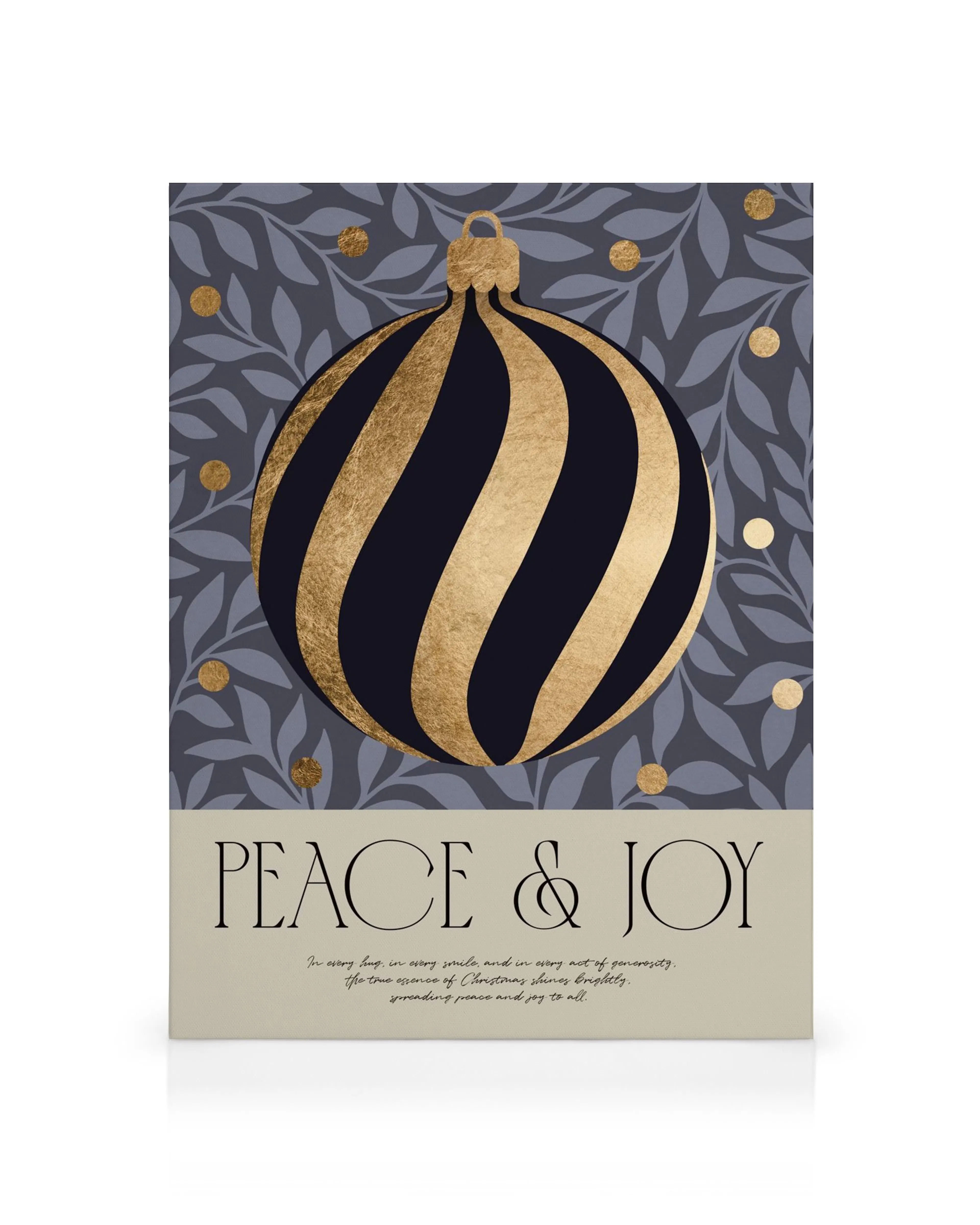 Peace and Joy Canvas print with a gold and dark blue Christmas ornament on a leafy background.