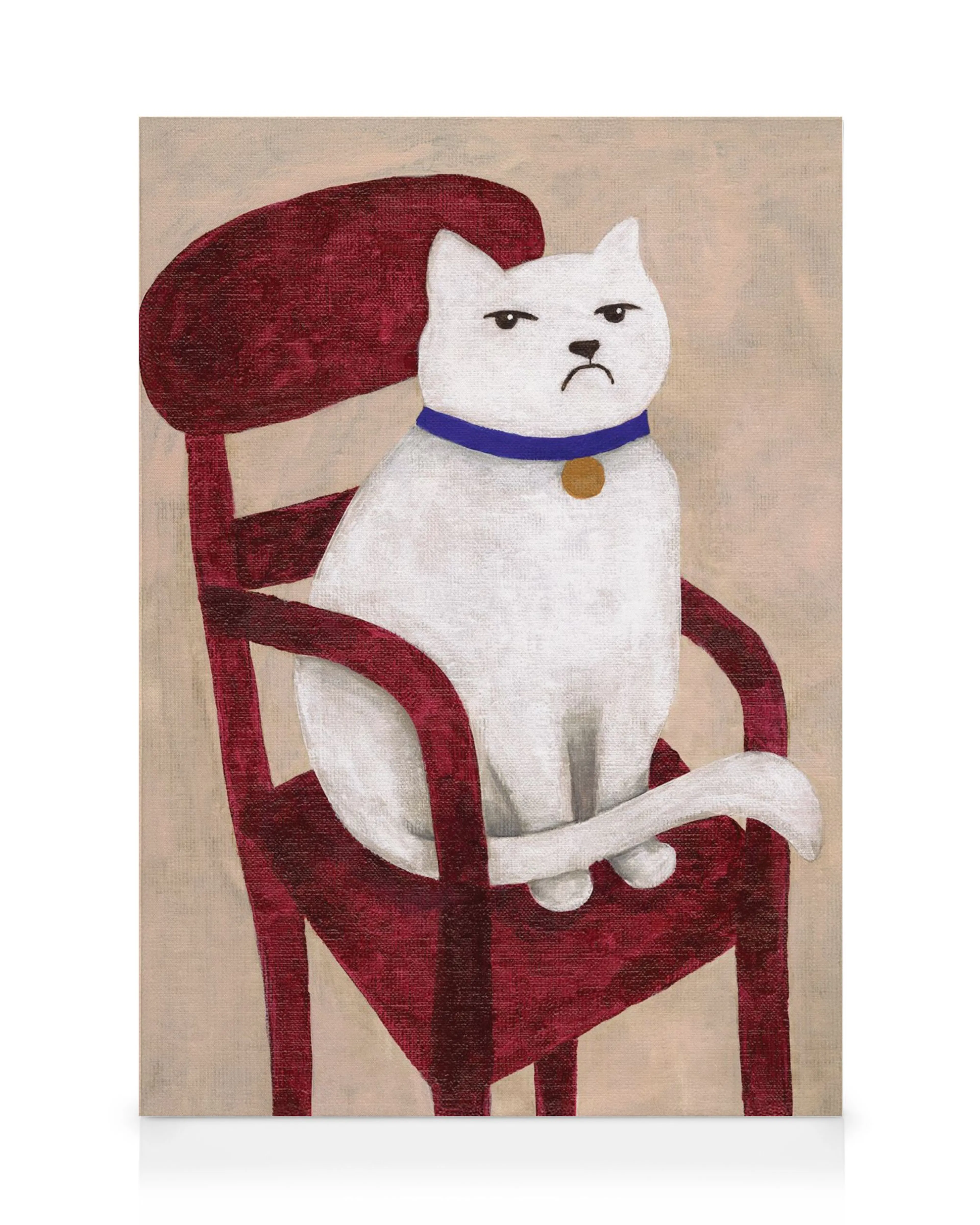 A canvas print featuring a grumpy white cat with a blue collar sitting on a red chair.