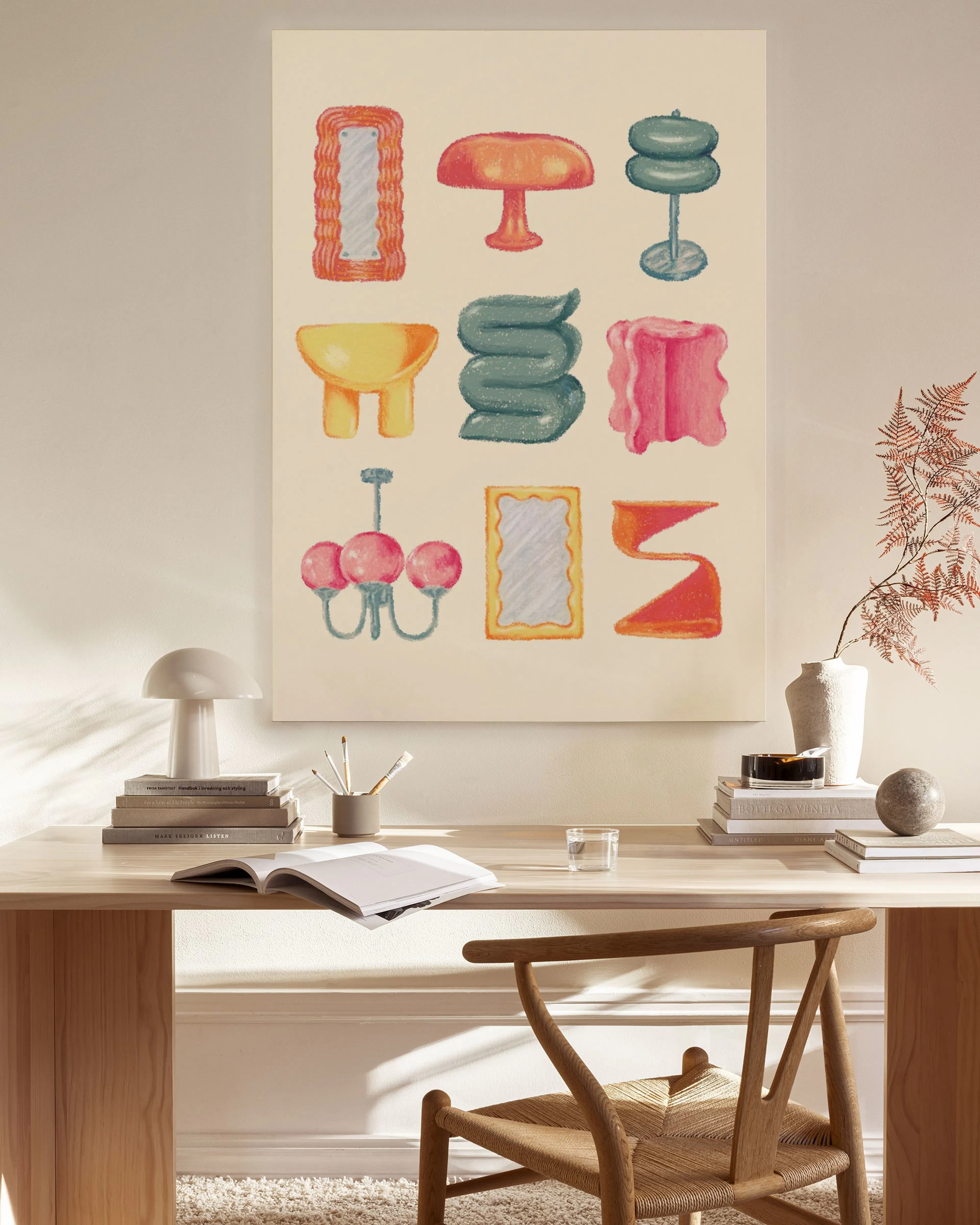 A canvas print with colorful, whimsical shapes, resembling furniture and decor, hanging in a bright, minimalist living room.